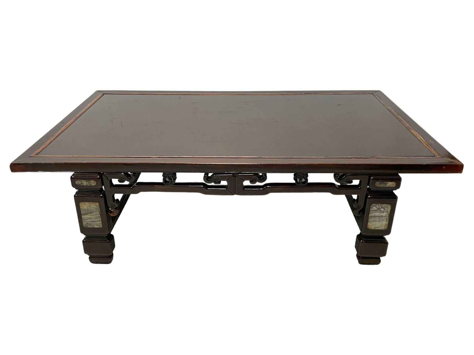 19th century Chinese stained hardwood coffee table, rectangular top with inset rattan surface and moulded slip, the pierced frieze carved with stylised clouds and floral motifs, the turned rectangular supports inlaid with 'dreamstone' type plaques, united by stretchers