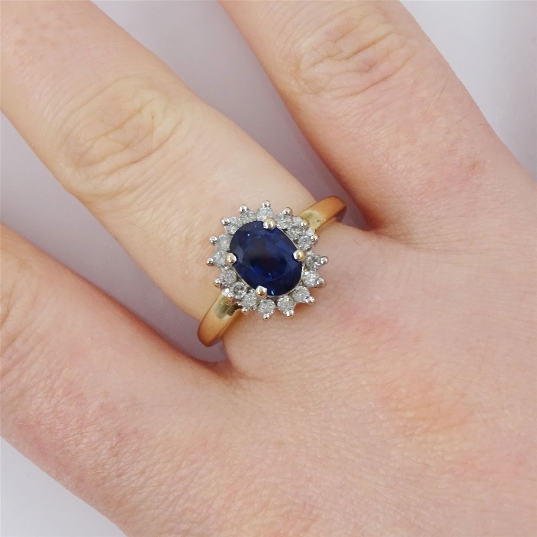 9ct gold oval cut sapphire and round brilliant cut diamond cluster ring, hallmarked