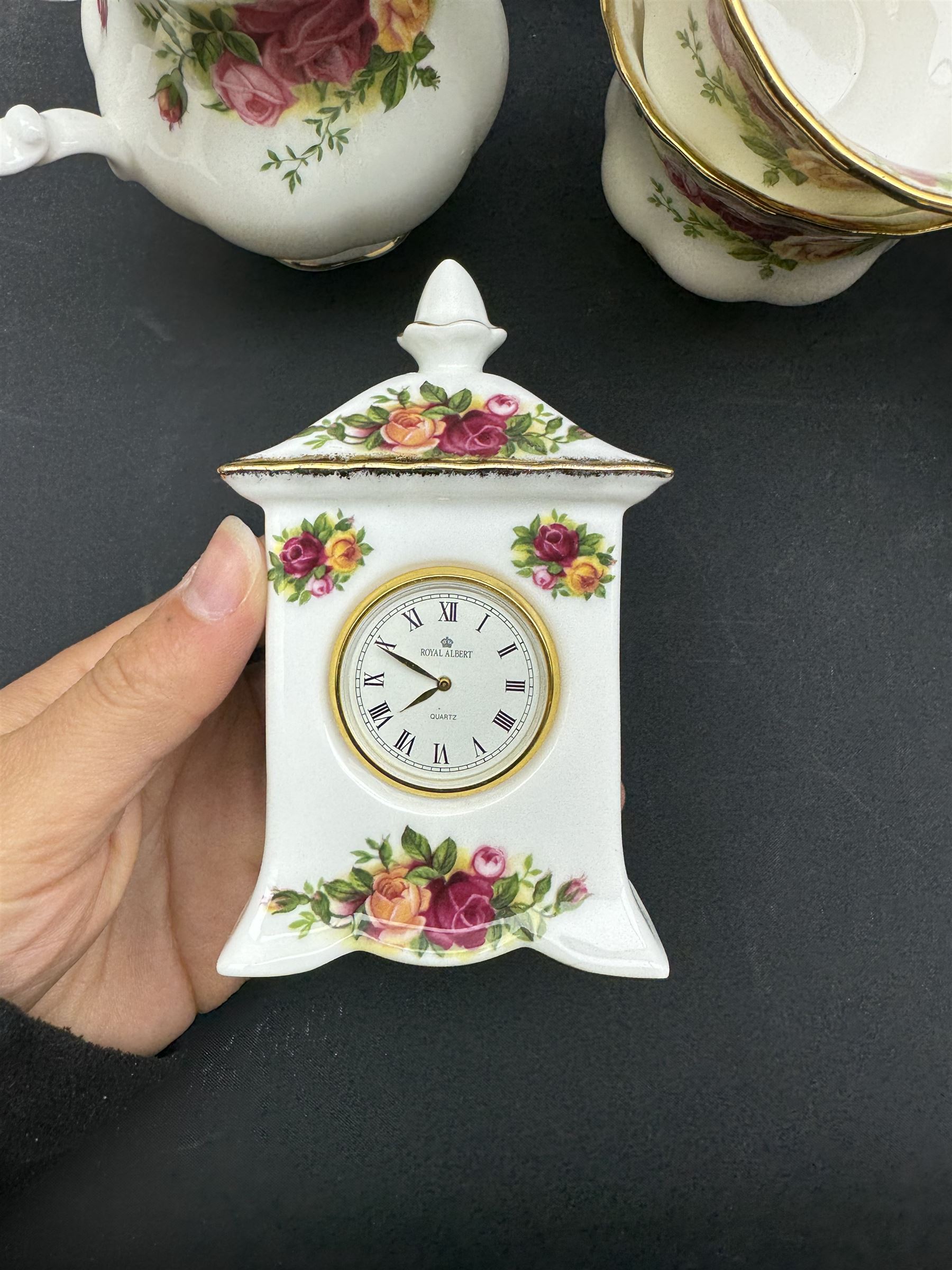 Royal Albert Old Country Roses tea service for six, comprising teapot, milk jug, open sucrier, cups and saucers, dessert plates, two trinket dishes covered jar and clock