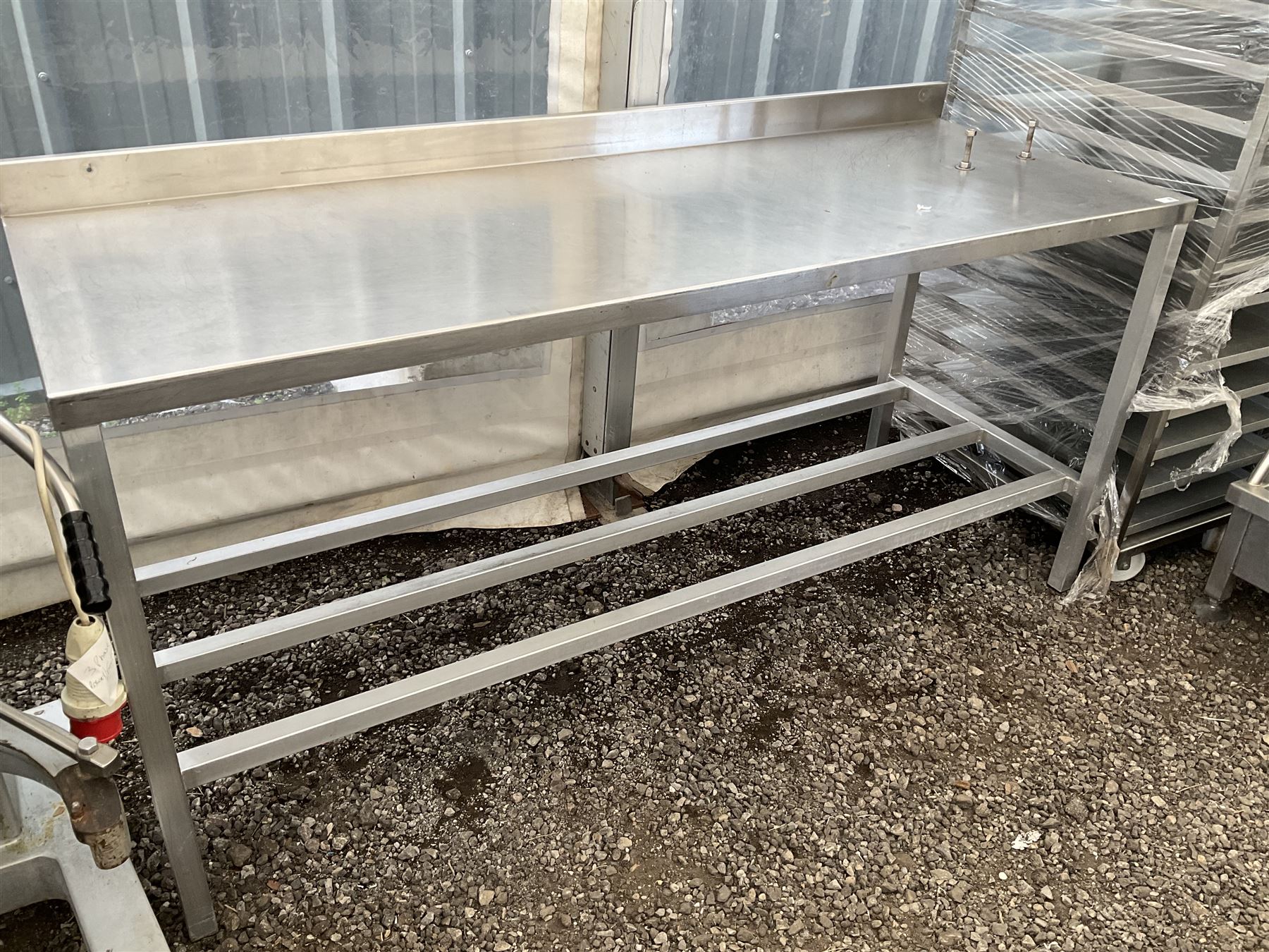 Aluminium framed preparation table with stainless top, barred under-tier, raised back, fixing bolts on top - THIS LOT IS TO BE COLLECTED BY APPOINTMENT FROM DUGGLEBY STORAGE, GREAT HILL, EASTFIELD, SCARBOROUGH, YO11 3TX