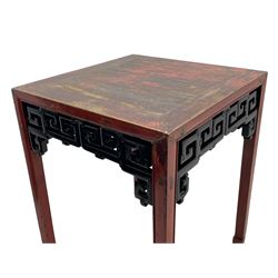 Late 19th century Chinese Qing dynasty red and black lacquered wood tall tea table, Shanxi region, square top over geometric scroll fretwork panels, on square supports with hoof feet 