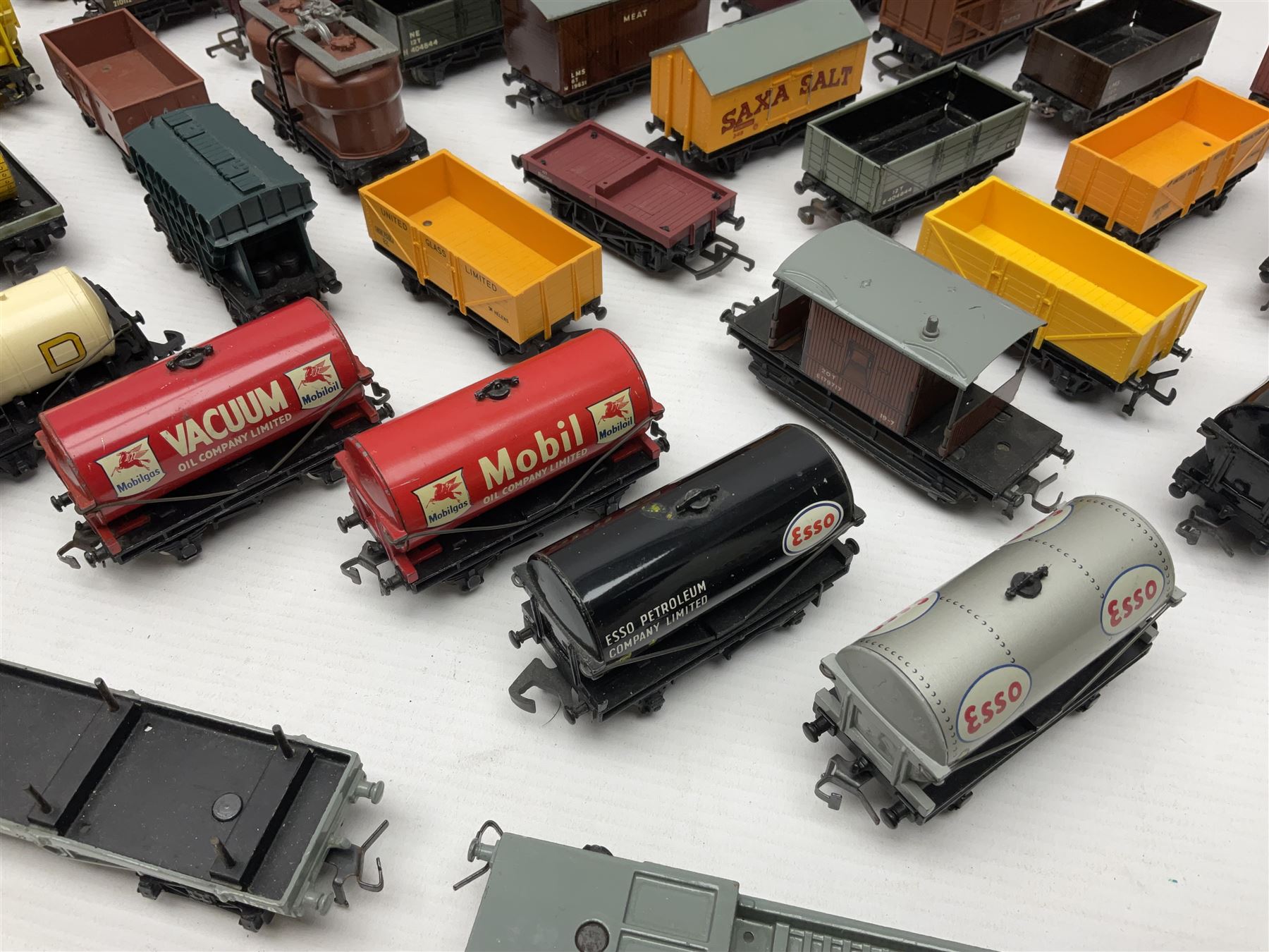 Hornby Dublo - forty-three goods wagons including nine tank wagons (Esso, Mobil, Vacuum, UD and Traffic Services), brake vans, meat and fish wagons, bogie well and bolsters, cable drums, open wagons, salt and grain wagons, etc; and six others by Tri-ang etc; all unboxed (49)