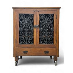 Mid-20th century Eastern hardwood and cast iron side cabinet, rectangular top over twin ca...