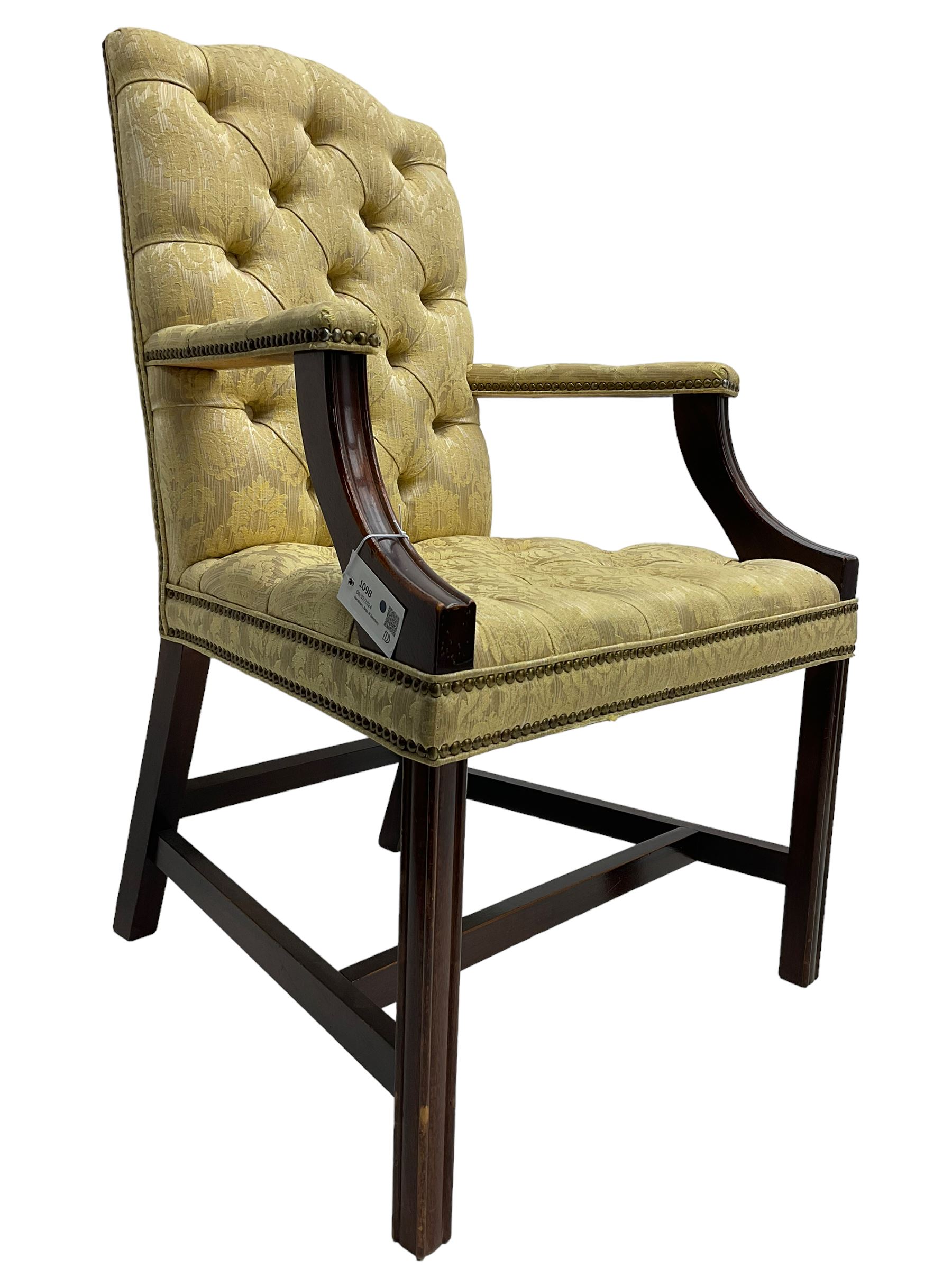 Georgian design mahogany framed Gainsborough open armchair, upholstered in pale gold buttoned fabric with floral pattern, on square moulded supports united by plain stretchers 