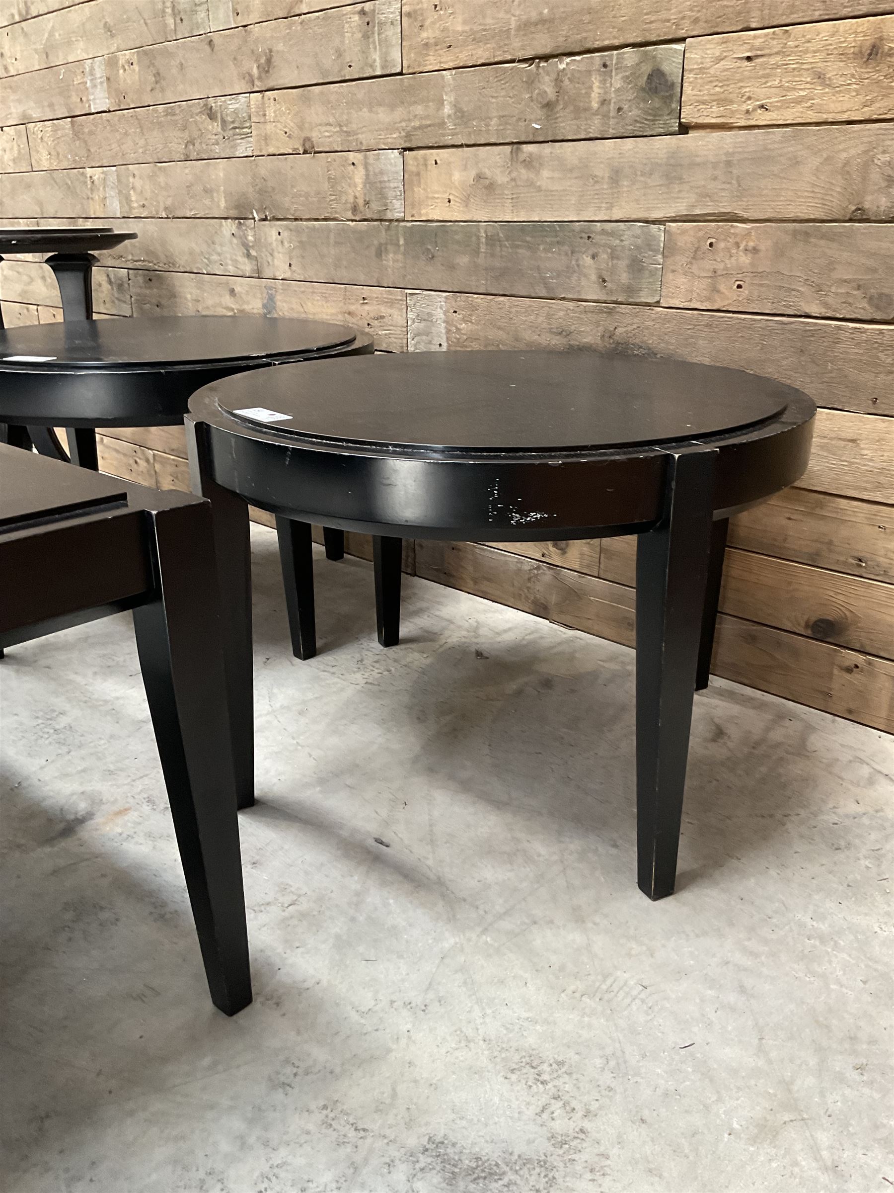 Three rectangular ebonised coffee tables and three circular tables