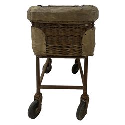 Early 20th century GPO wicker and hide bound postal trolley, on a cast iron base with castors