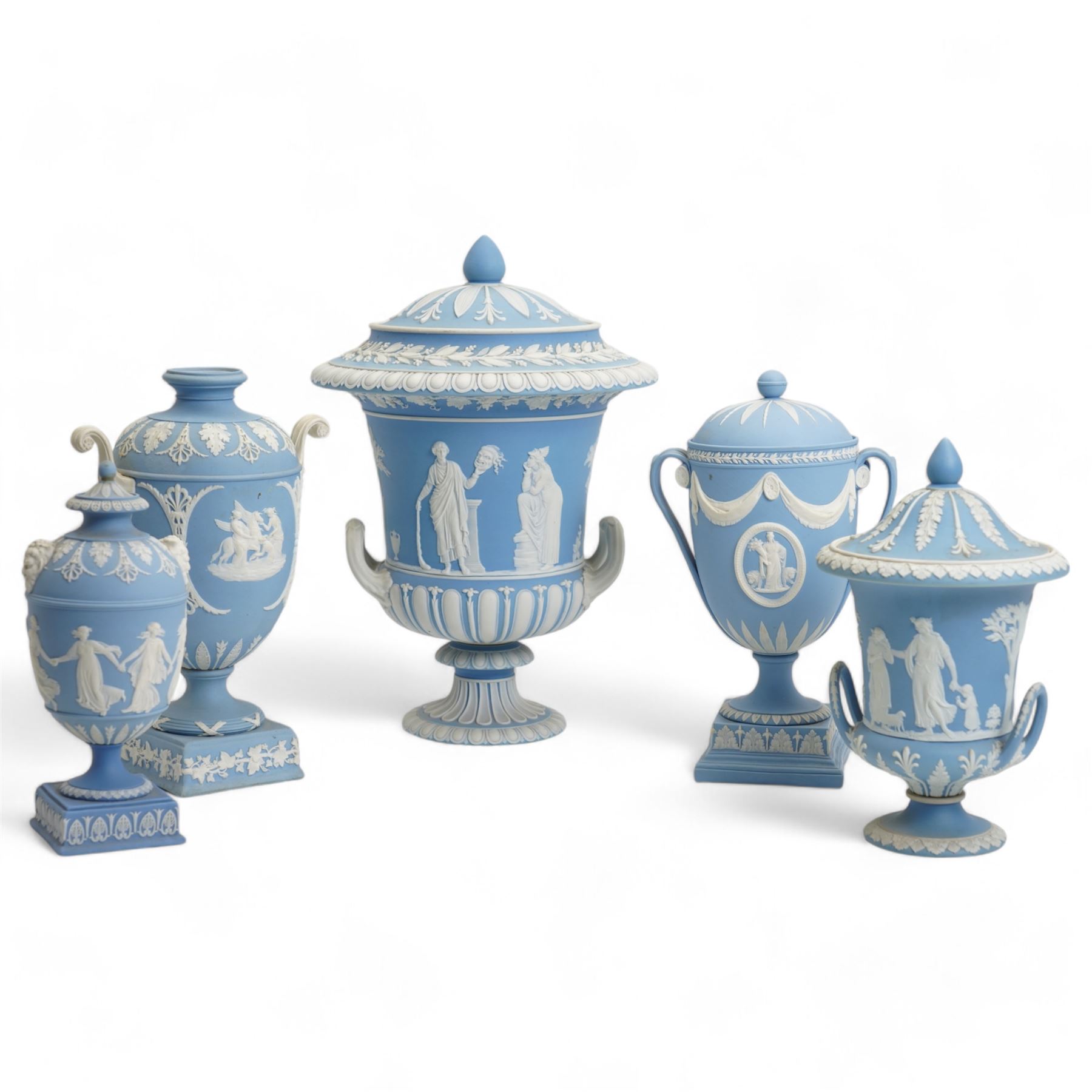 Group of five late 19th and early 20th century Wedgwood blue jasperware urn vases, H28cm and smaller (5)