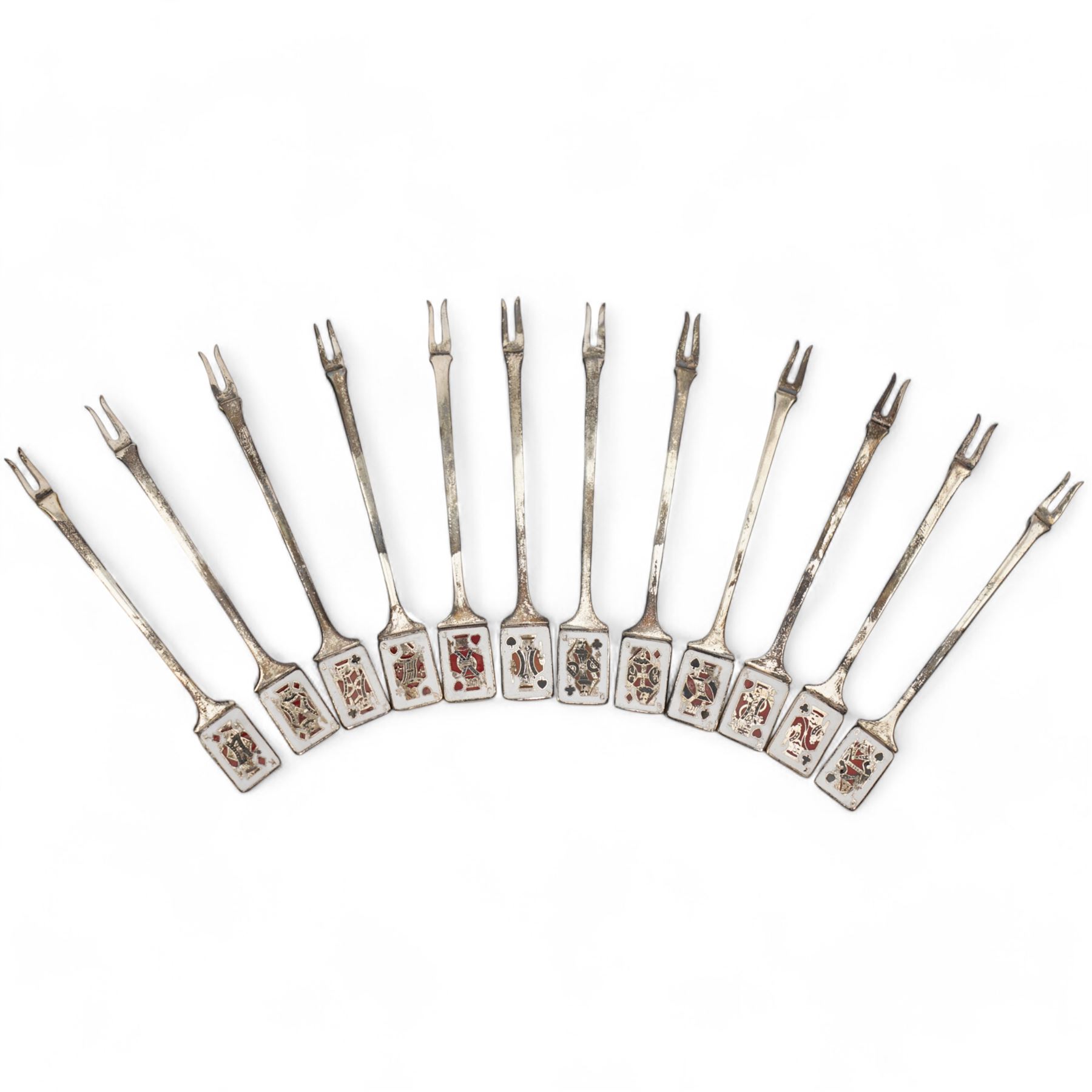 Set of twelve mid 20th century silver pickle forks, the terminals with enamelled playing card decoration, hallmarked Garrard & Co Ltd, Birmingham 1961, in original case