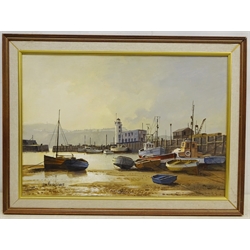  Don Micklethwaite (1936-): Beached Fishing Boats in Scarborough Harbour, oil on board signed 34.5cm x 50cm  