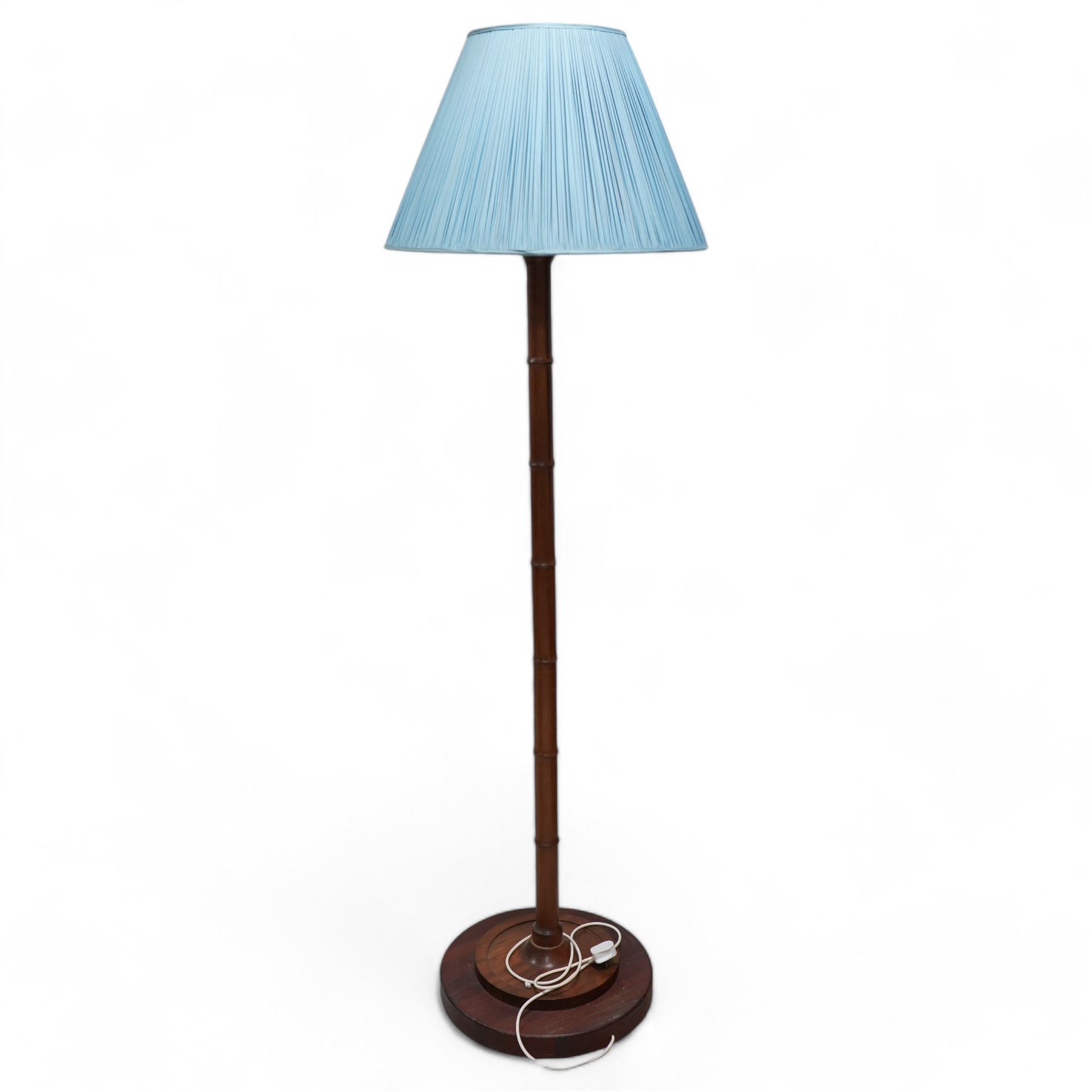 Hardwood simulated bamboo standard lamp, on stepped circular base, with blue pleated shade 