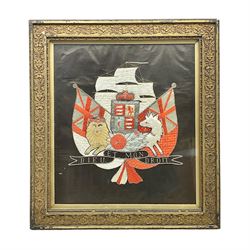 Early 20th century silk needlework panel, depicting a ship in full sail and Royal Coat of Arms to centre, with red and white ensigns to either side, lion and unicorn below with quote 'Dieu Et Mon Droit', upon a black silk ground within gilt frame, H59cm