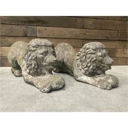 Pair of small cast stone garden recumbent lions