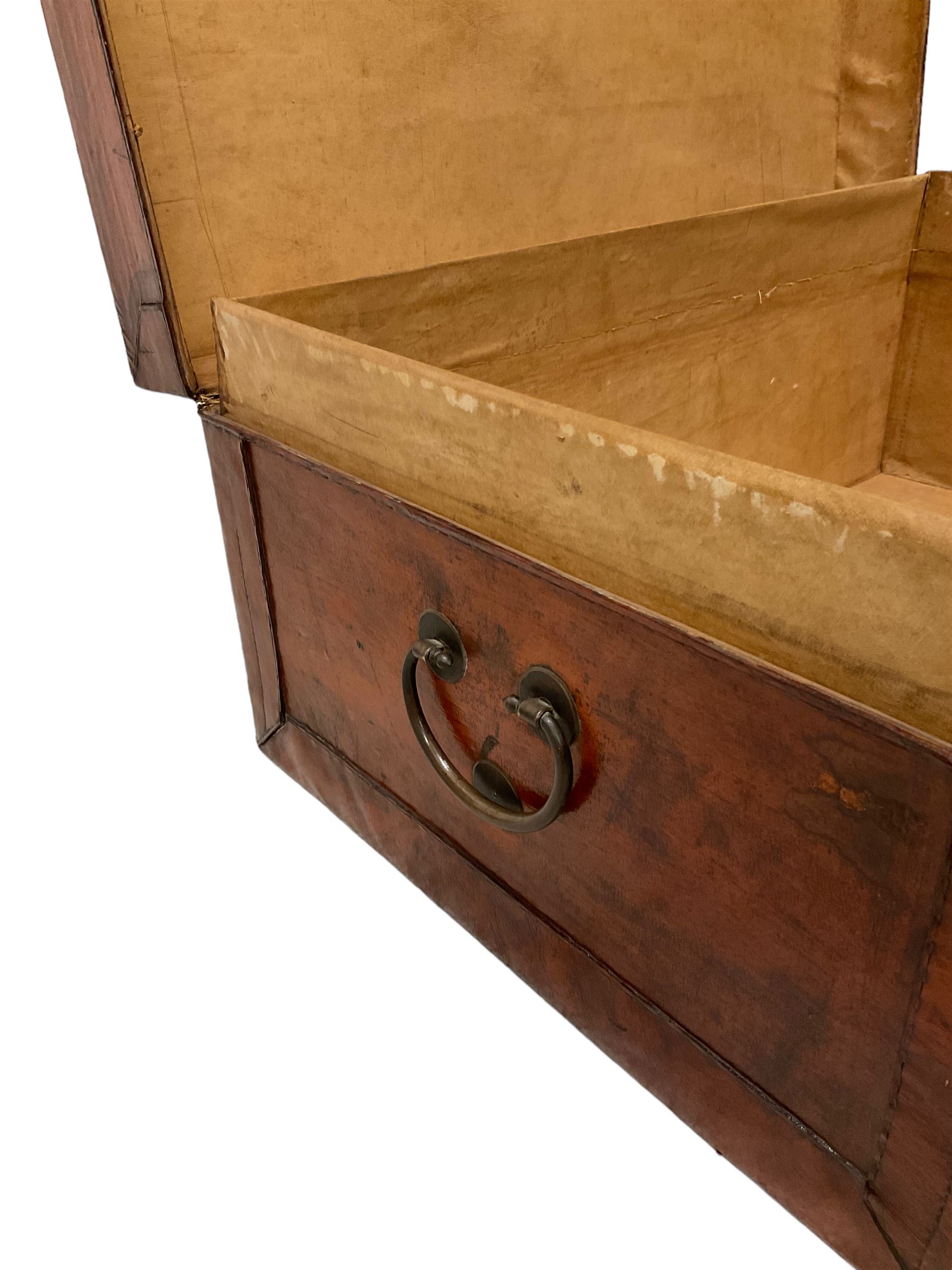 Chinese leather bound and wooden trunk, fitted with metal locks and twin carrying handles, on ebonised stand 