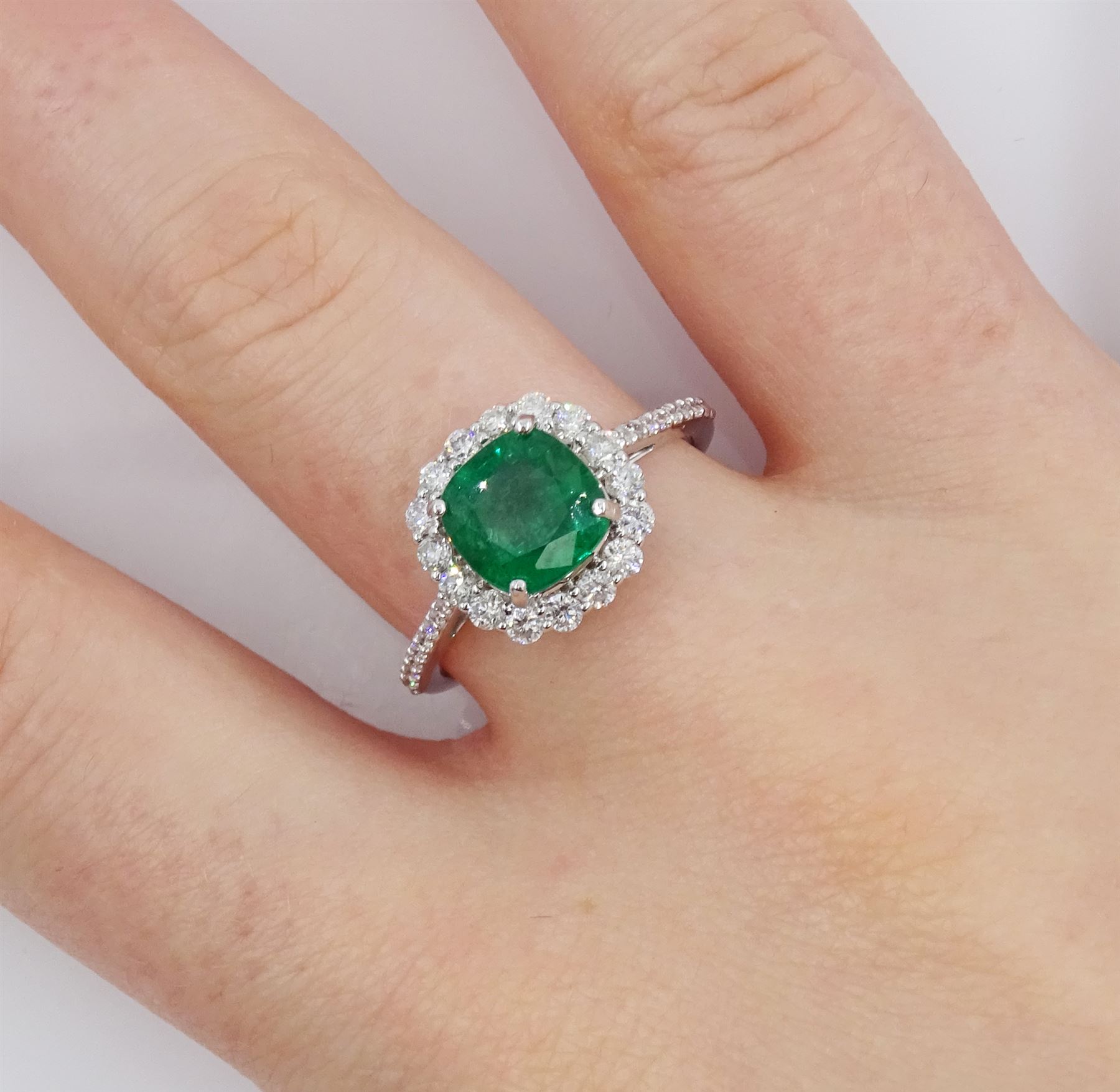 18ct white gold cushion cut emerald and round brilliant cut diamond cluster ring, stamped 750, emerald approx 1.85 carat, total diamond weight approx 0.55 carat