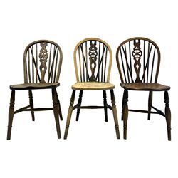 Mid-to-late 20th century set of six elm and beech Windsor dining chairs, hoop and stick back with pierced wheel splat, dished elm seat, on turned supports united by turned stretchers 