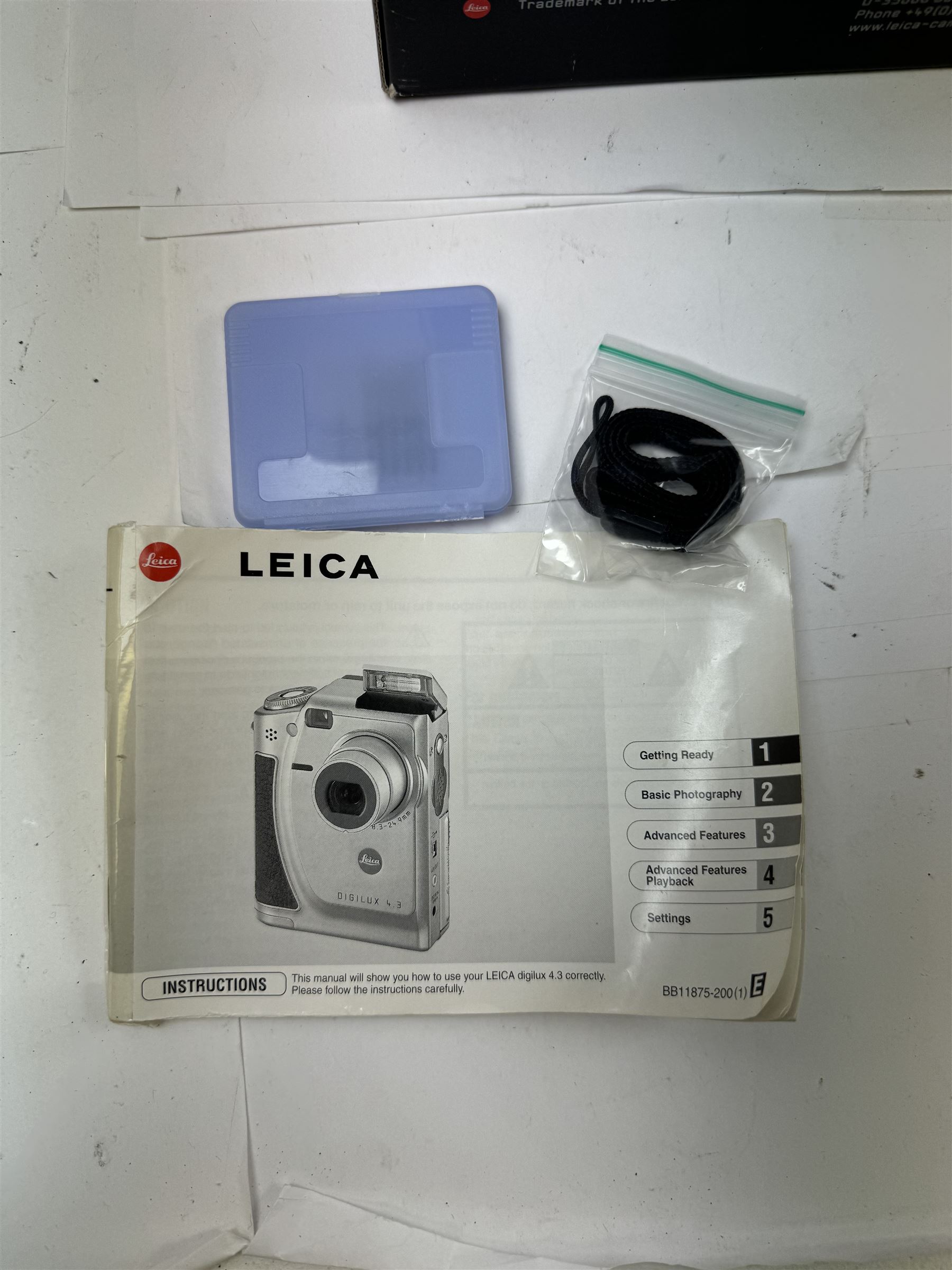 Leica C11 APS film compact camera, in silver and chrome finish, serial no. 2636834, in original clear hard case and box, with instruction booklet, together with a Leica Digilux 4.3, with 1:2.8-4.5/8.3-24.9mm lens, serial no. 2598862, with instruction booklet