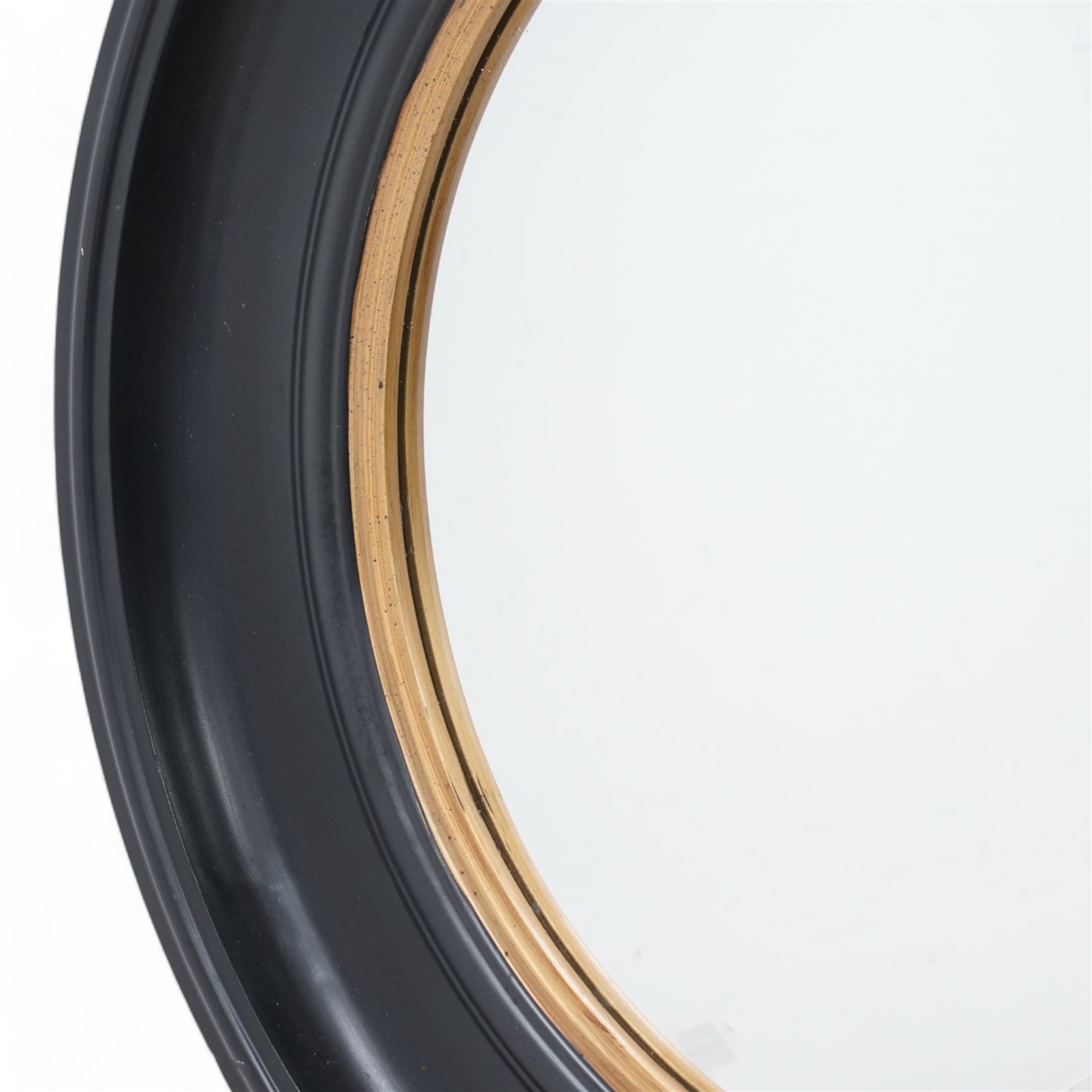 Regency design circular convex wall mirror, in moulded ebonised frame with gilt inner slip 