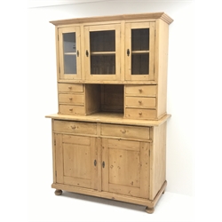 Early 20th century pine kitchen cupboard, raised glazed cabinets with drawers, lower section fitted with two drawers and panelled double cupboard, turned feet,  W127cm, H195cm, D62cm