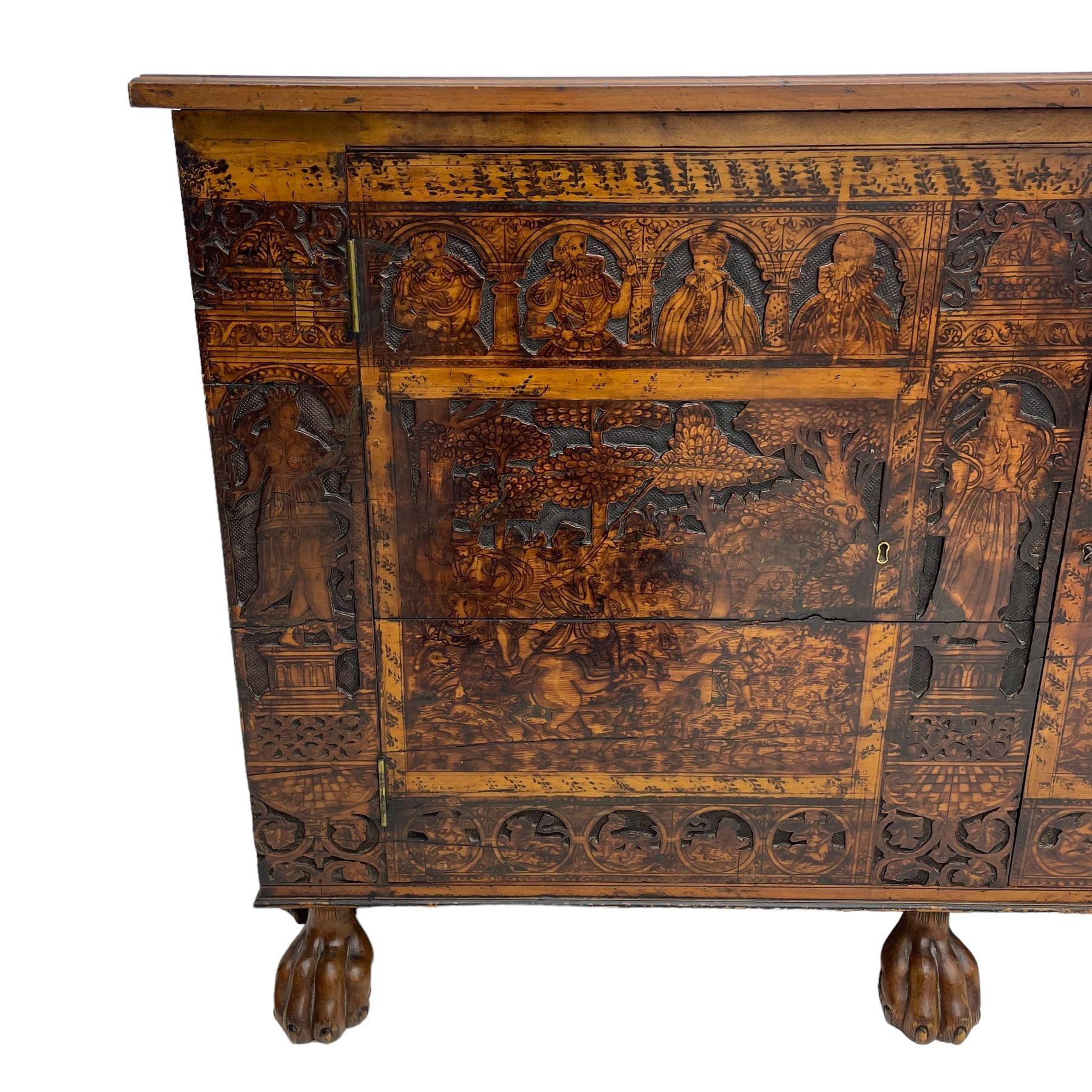 17th century and later cedarwood and pine side cupboard, moulded rectangular top, enclosed by two doors possibly removed and reused from a Venetian Cassone, carved and decorated with penwork, the upper architectural arcade with busts of noblemen, the larger decoration depicting hunters on horseback within woodland landscape with various animals, central and flanking uprights decorated with classical female figures upon pedestals, lower roundels decorated with lion and putto motifs, overall foliate decoration, raised on five hairy paw carved feet, the interior fitted with shelf