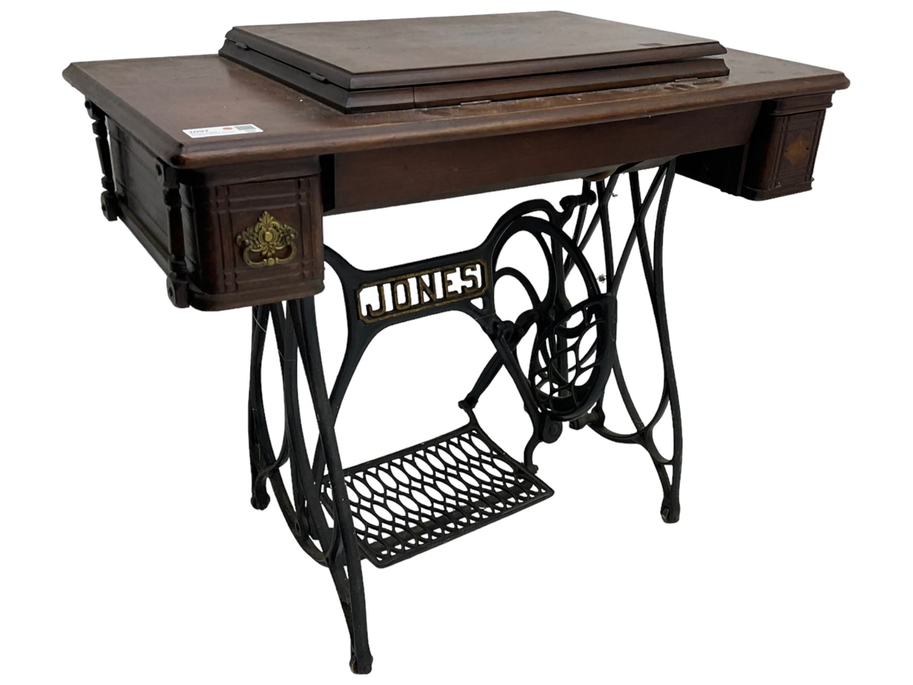 Early 20th century Jones treadle sewing machine table, bevel edged rectangular top with hinged lid enclosing sewing machine no. 480760, supported by cast iron treadle base