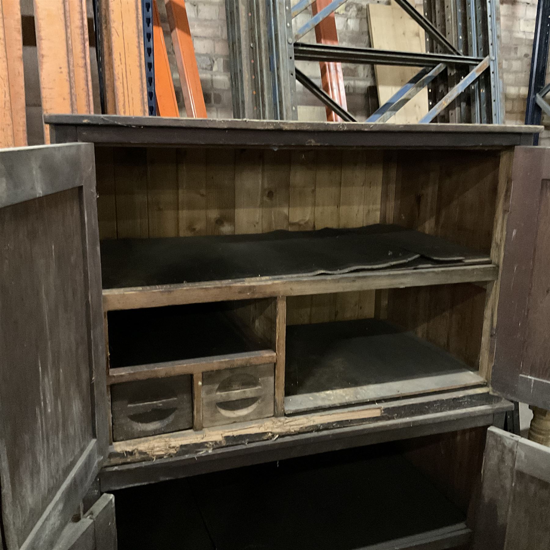 Two early 20th century pine cupboards, enclosed by panelled doors, each fitted with shelf and drawers  - THIS LOT IS TO BE COLLECTED BY APPOINTMENT FROM THE OLD BUFFER DEPOT, MELBOURNE PLACE, SOWERBY, THIRSK, YO7 1QY