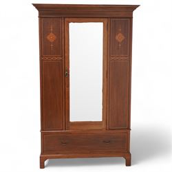 Edwardian inlaid mahogany wardrobe, projecting moulded cornice over panelled front and central bevelled mirror door, inlaid with satinwood shaped panels and trailing bell flowers, geometric inlaid bands and satinwood bands, single drawer to base, on bracket feet 