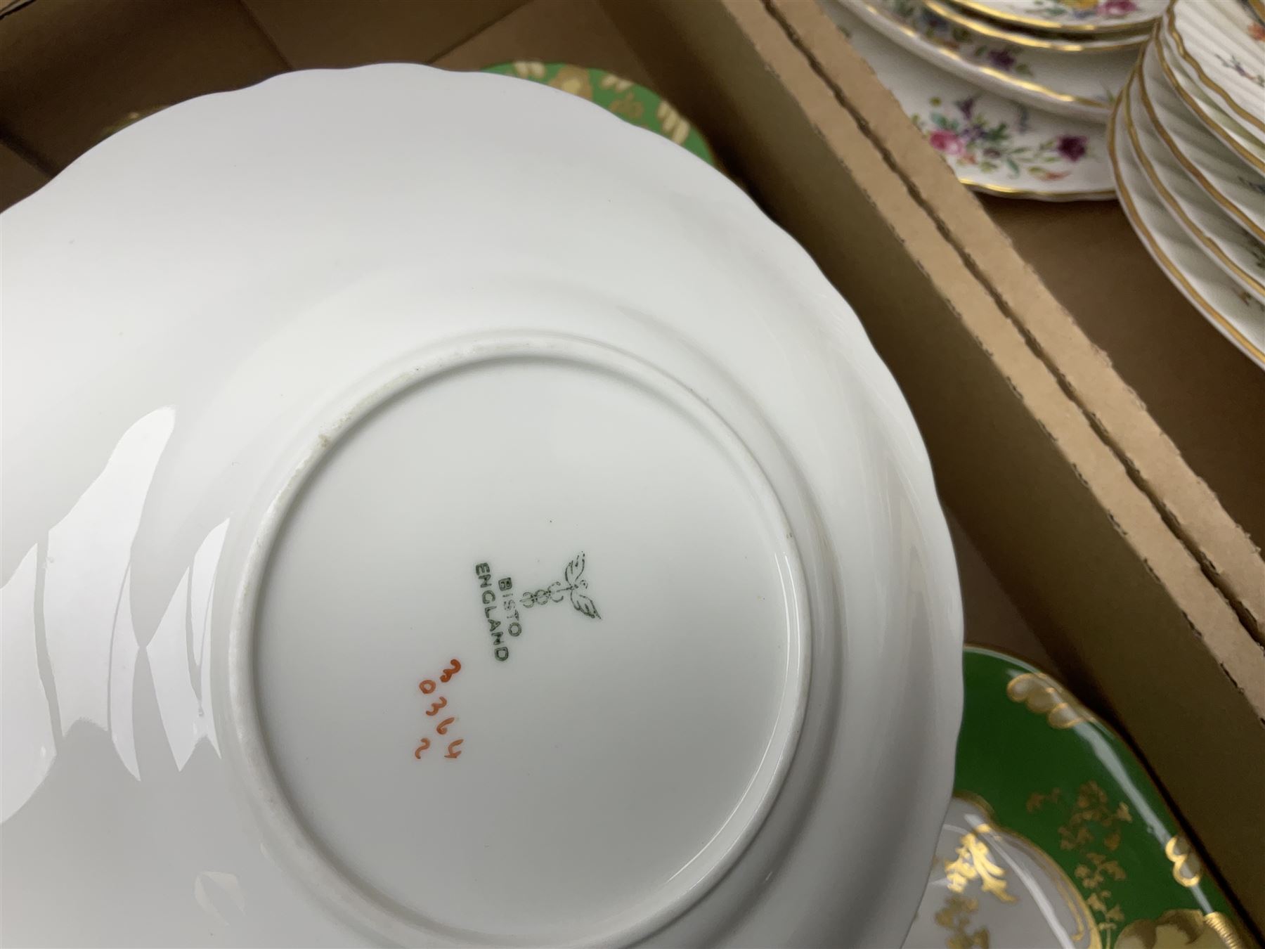 Minton Marlow pattern tea and dinner wares, including dinner plates, side plates, tea cups, cake plate, etc together with Bishops & Stonier 'Bisto' green and gilt tea wares and Maddock Ivory Ware dinner wares, in three boxes