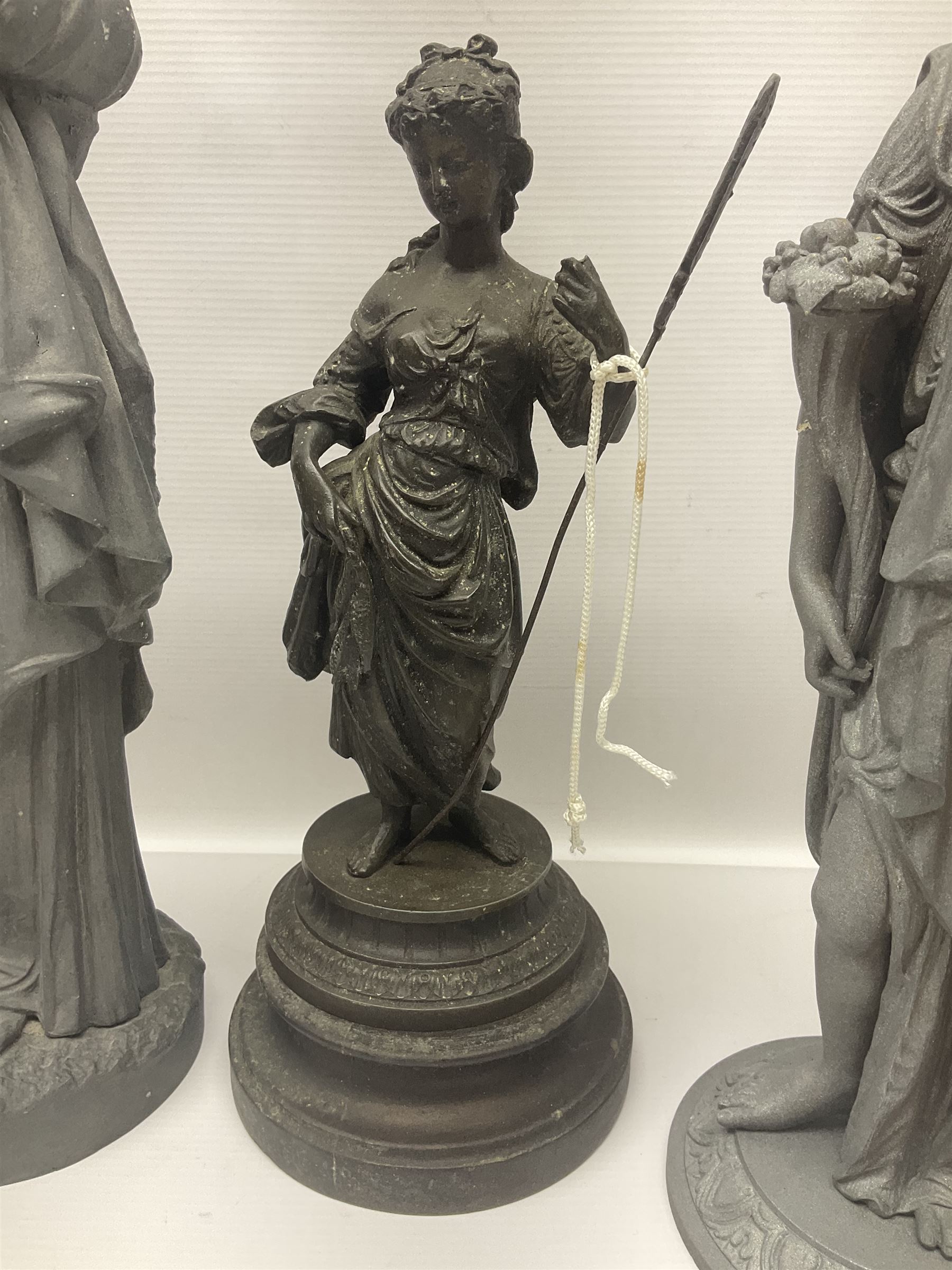 Four spelter figures of women in neoclassical dress, largest H47cm