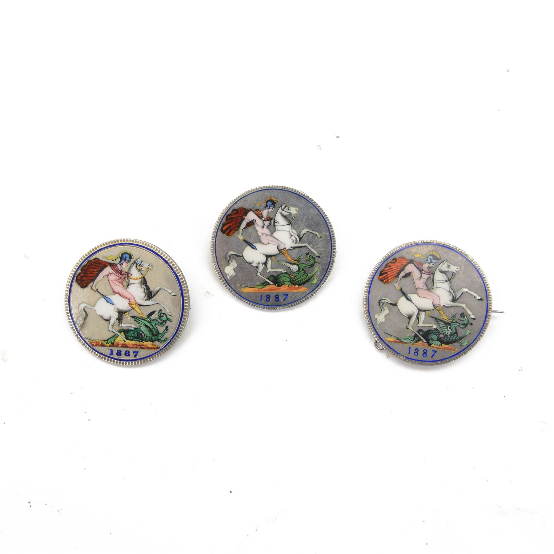 Three Queen Victoria 1887 enamelled silver crown coins, all with brooch mounts