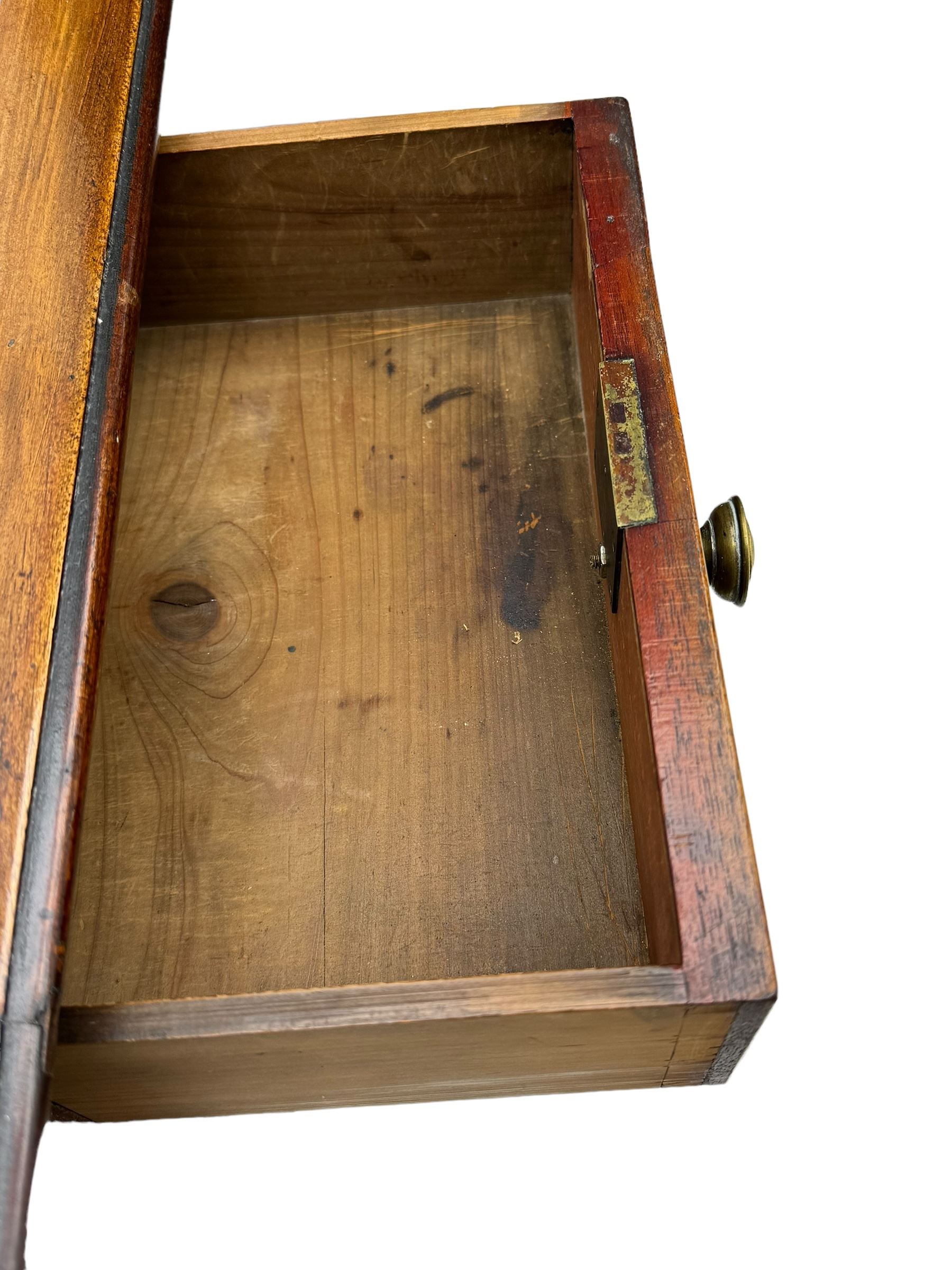 George III mahogany kneehole dressing or side table, moulded rectangular top over seven cock-beaded drawers, on ring turned support 