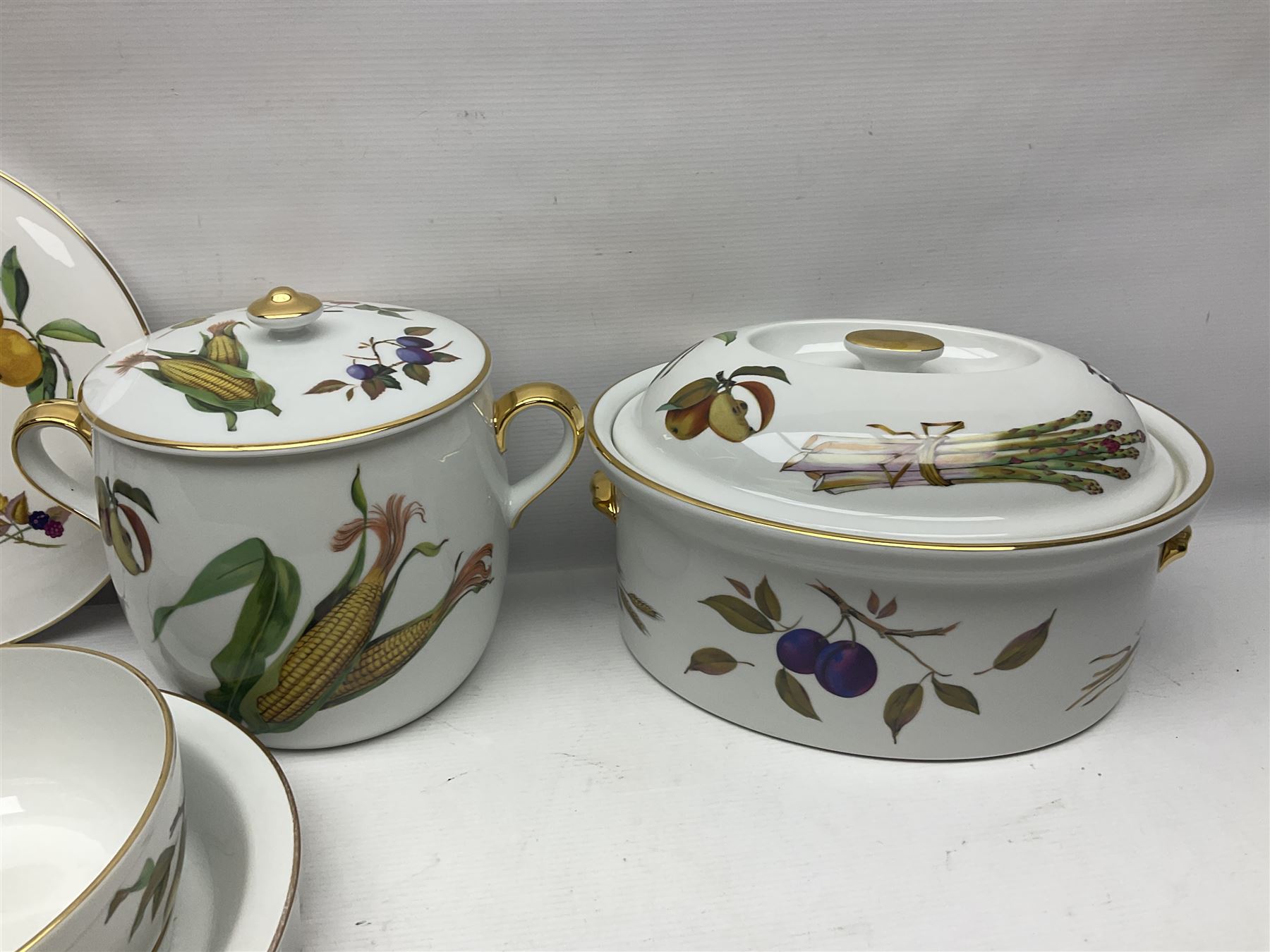 Royal Worcester Evesham pattern, including covered pot de cremes, twin handle tureen, serving dishes, flan dishes, side plates etc  