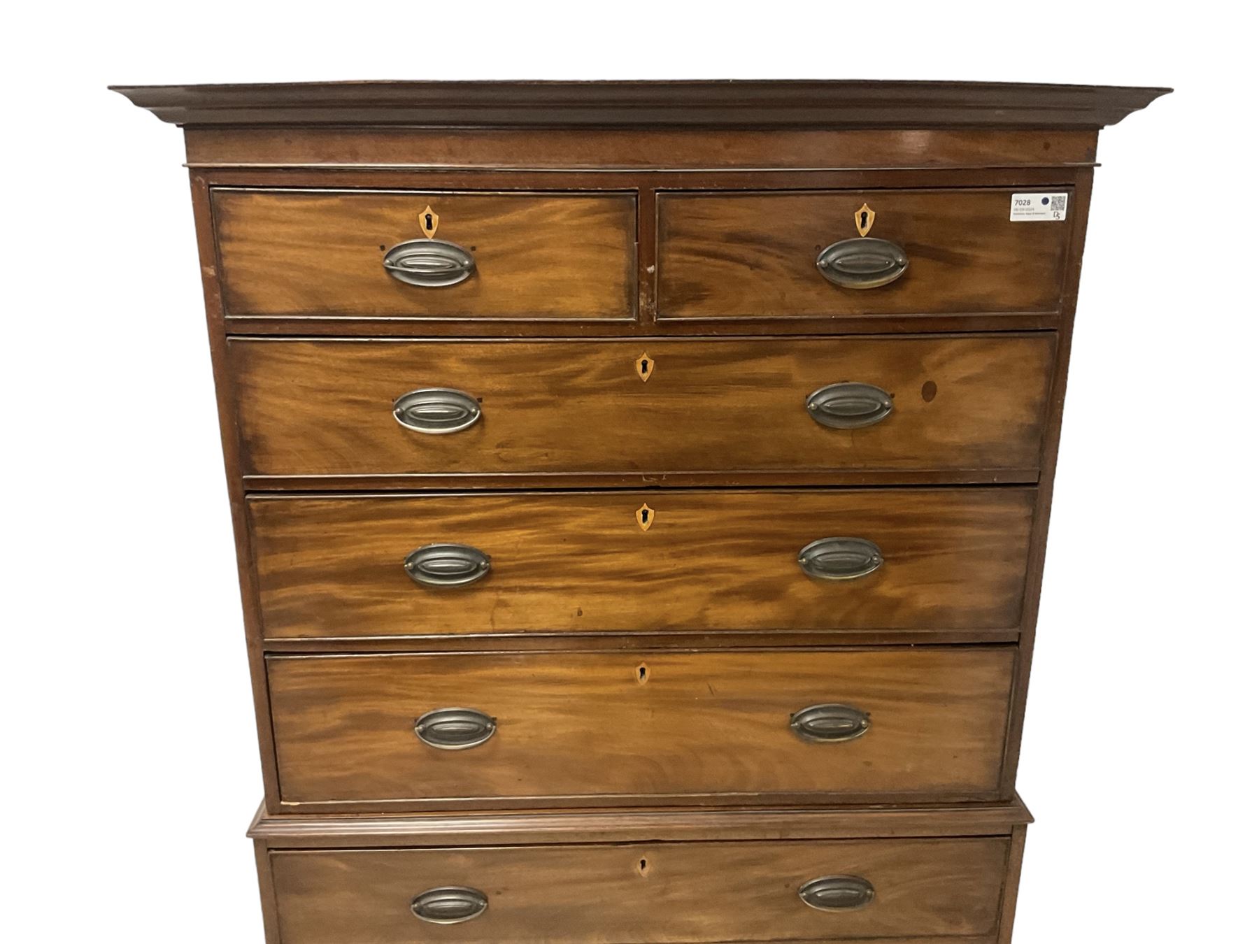 Early 19th century mahogany chest-on-chest, projecting cornice over banded frieze, fitted with two short over six long graduating cock-beaded drawers with bone and timber escutcheons, on bracket feet