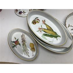 Royal Worcester Evesham pattern, including covered pot de cremes, twin handle tureen, serving dishes, flan dishes, side plates etc  