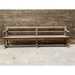 Victorian pitch pine bench pew, turned arms and legs, rail back with plank seat, 274cm