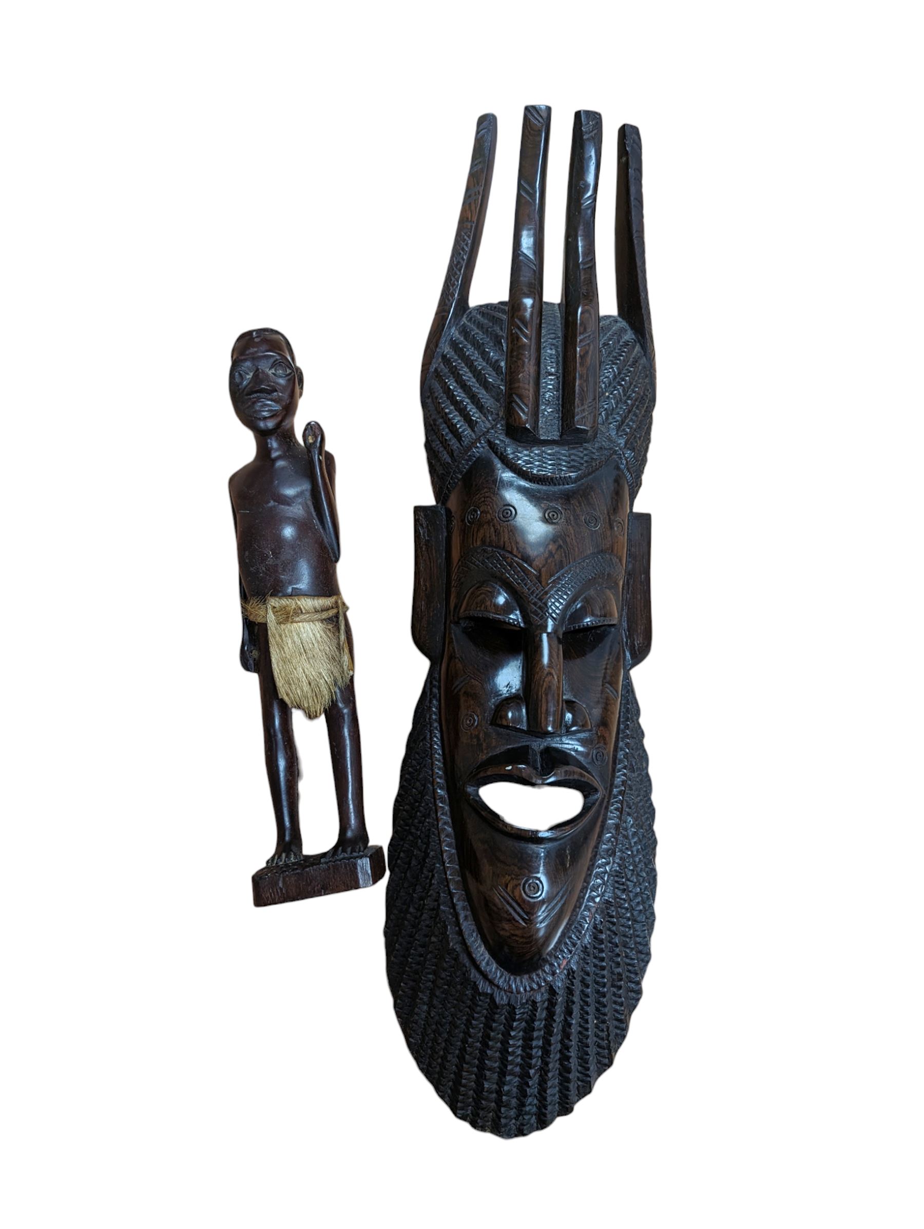 Carved tribal mask and a carved wooden figure