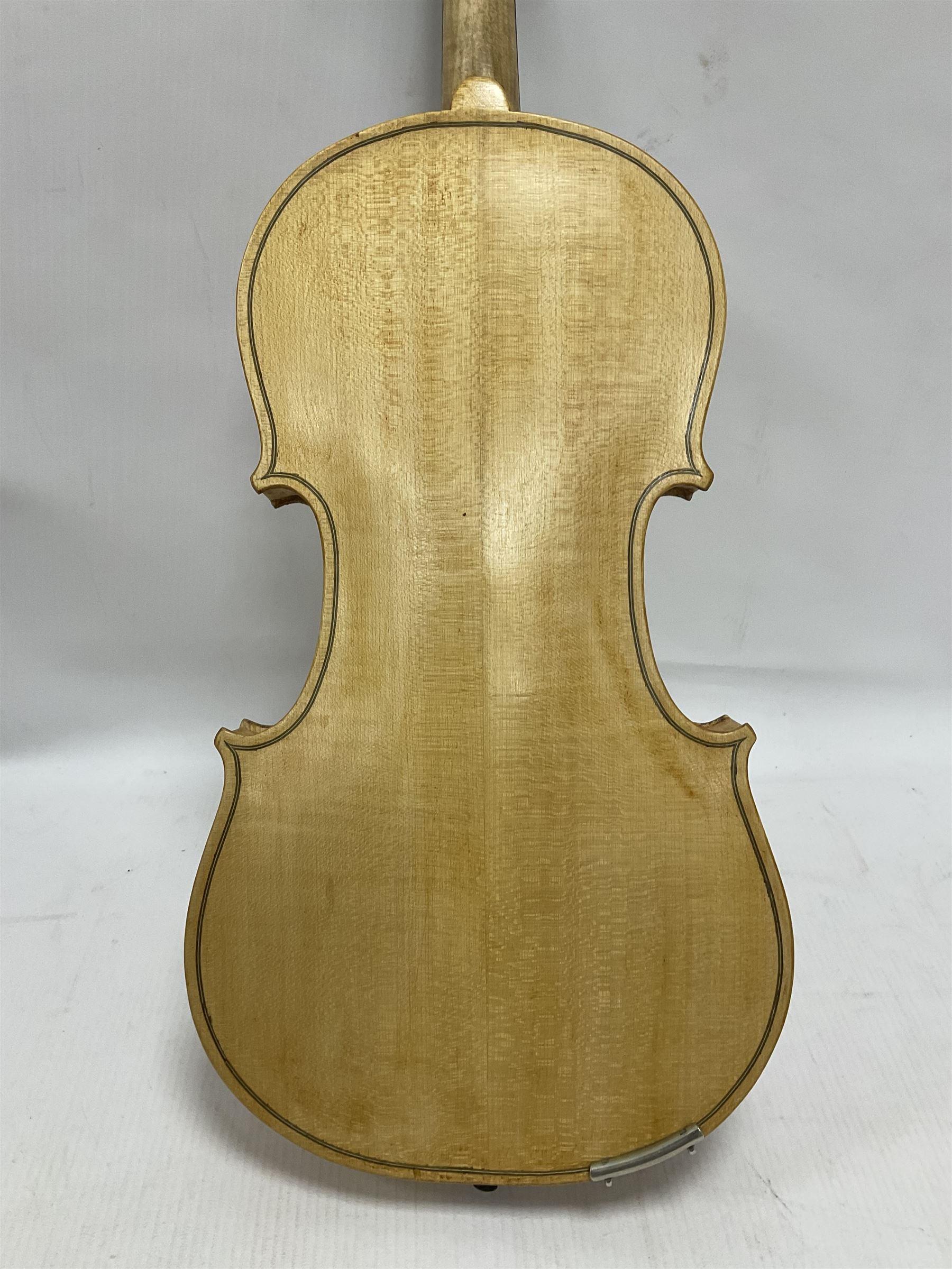 Copy of a full size Stradivarius violin with an ebonised fingerboard and tailpiece, hardwood tuning pegs and chin rest length 60cm