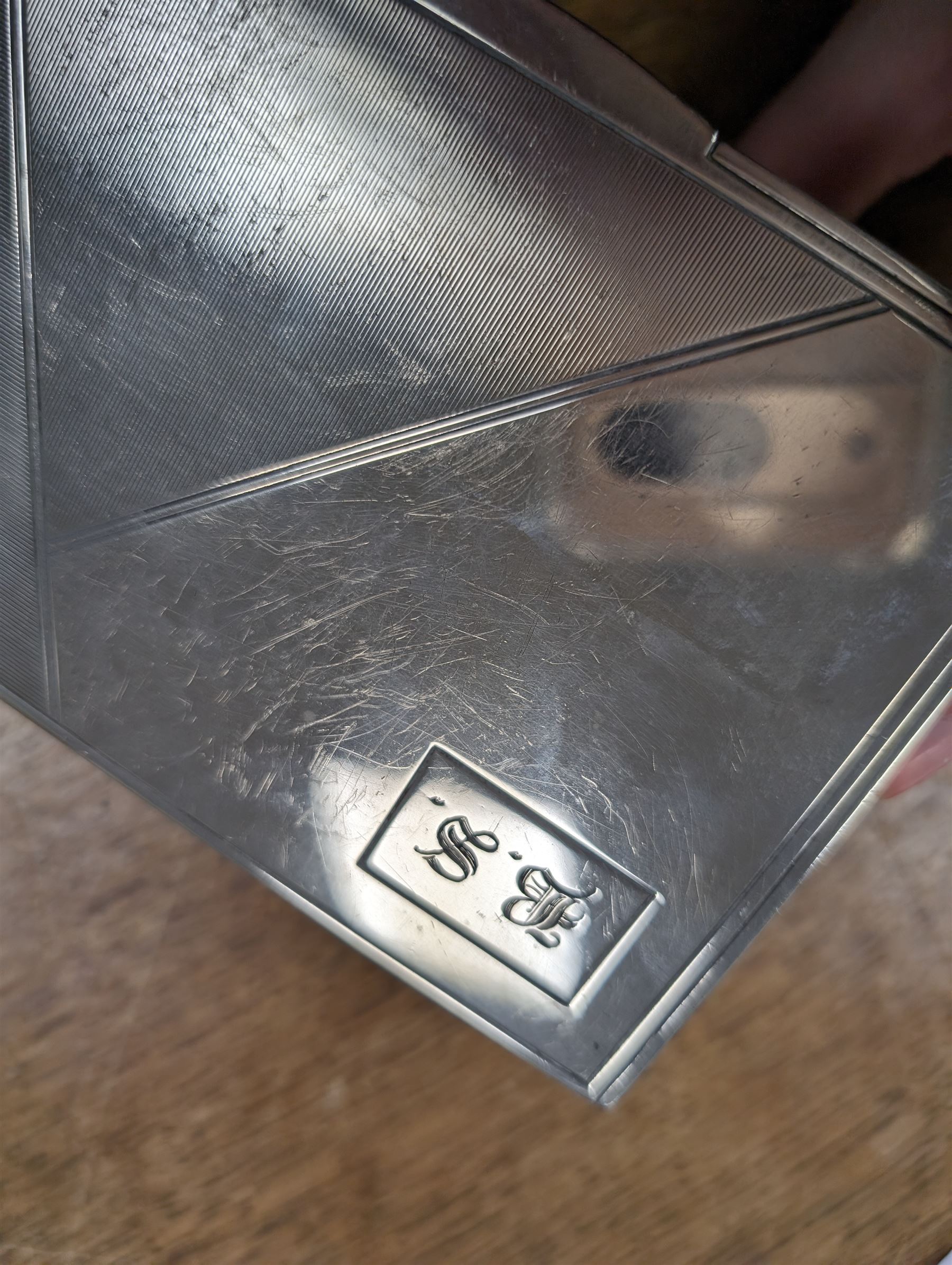 1930s silver mounted cigarette box, of rectangular form, with engine turned decoration and engraved cartouche to hinged lid, opening to reveal a softwood interior, hallmarked London 1930, maker's mark worn and indistinct