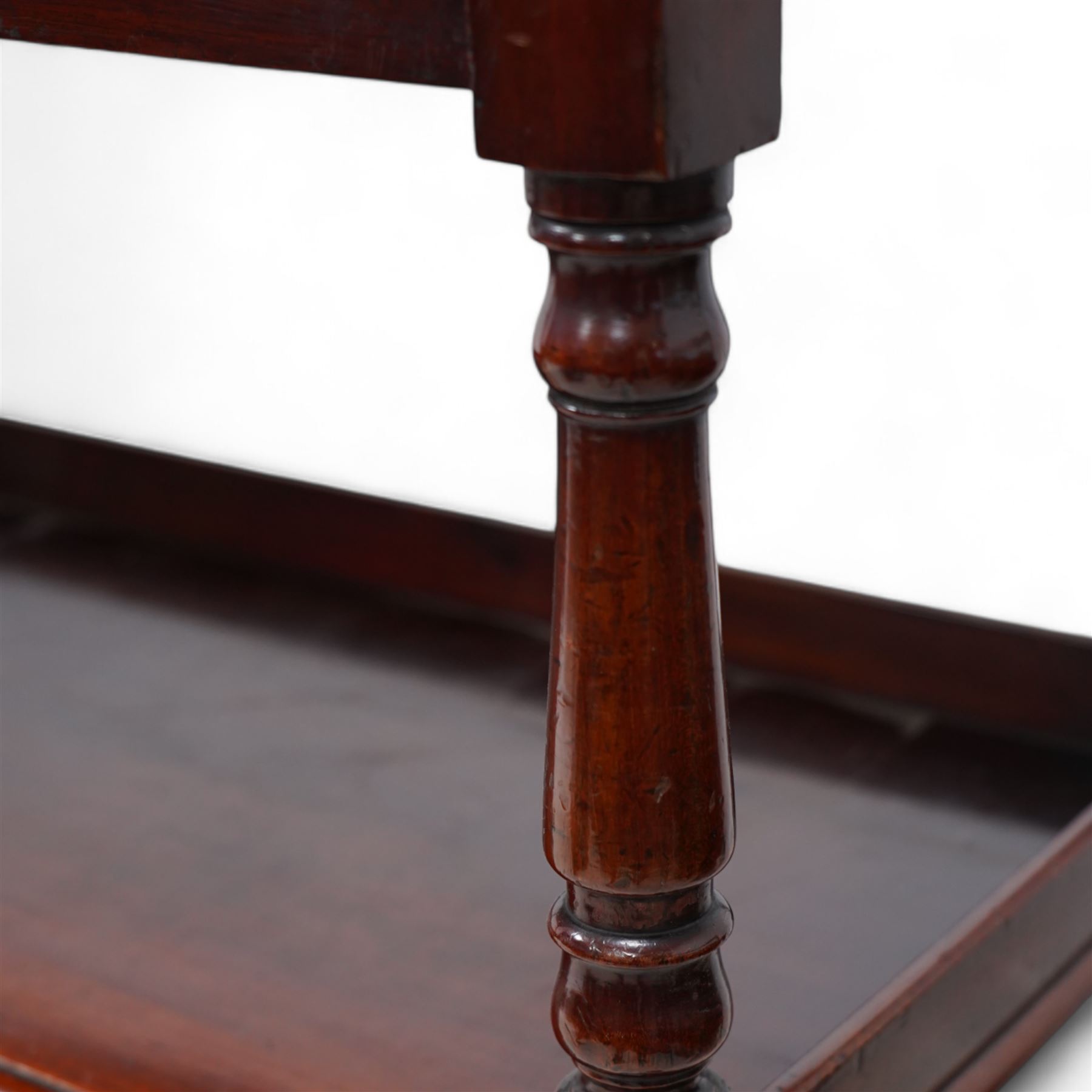 Victorian mahogany three-tier buffet, raised three-quarter gallery back with surmounted turned finials and moulded front edge, raised on turned supports and uprights terminating to castors