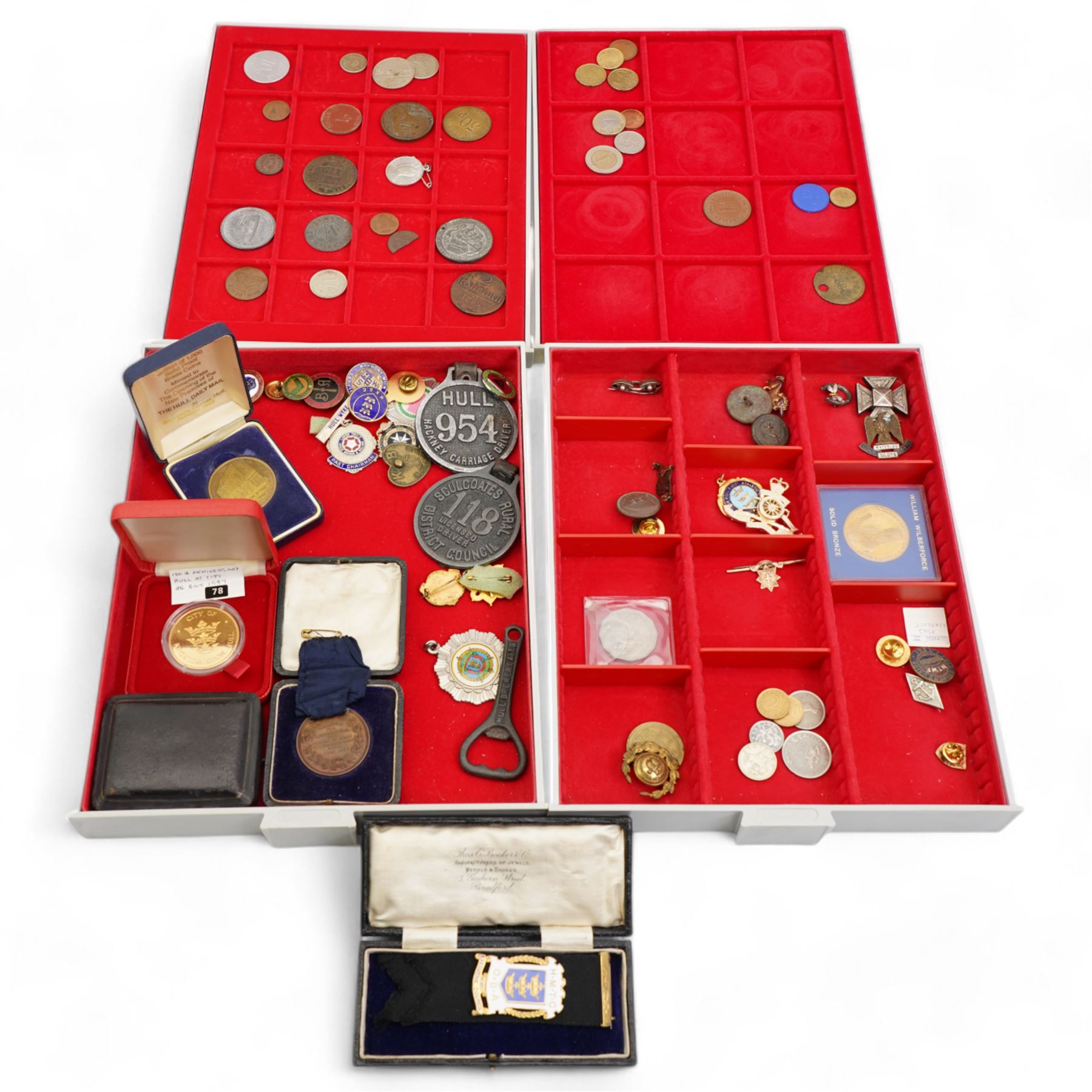 Tokens, medallions and miscellanea, including 'Hedley Swan and Co Ltd Joplings' one penny, 'Blackmores Beverley Road' one shilling, 'Brett's Limited' one shilling, various pin and other badges, buttons, Goldstream Guards bar brooch, small number of coins etc, housed in four Lindner trays