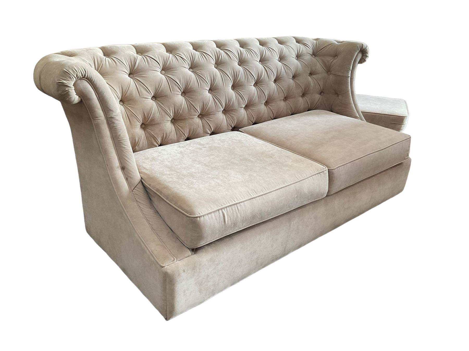 Grande wing back sofa bed, upholstered in beige buttoned fabric, metal action pull out double bed