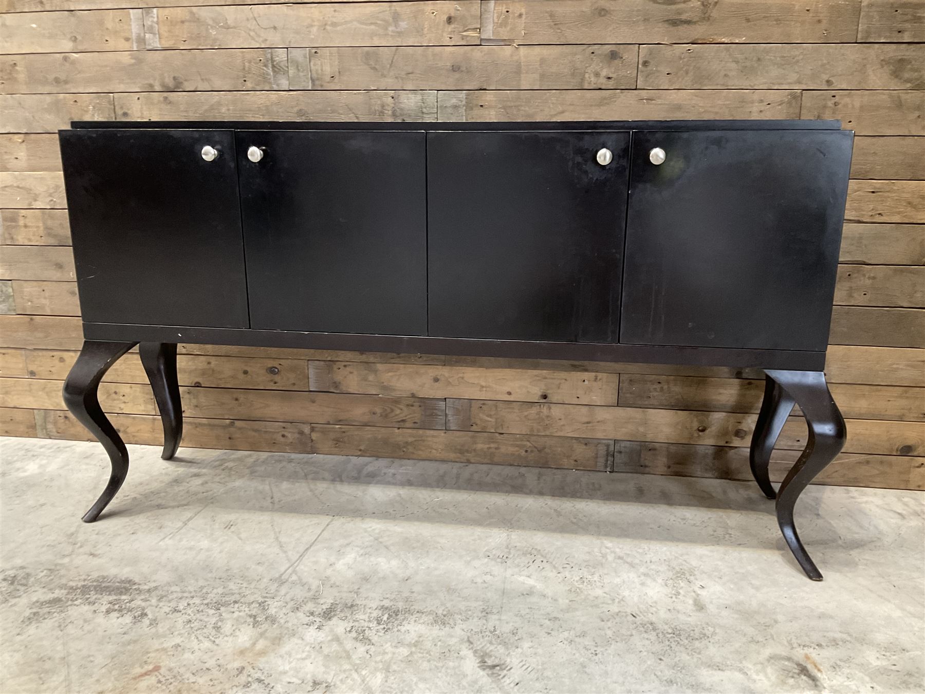 Rosewood finish four door sideboard, on cabriole legs