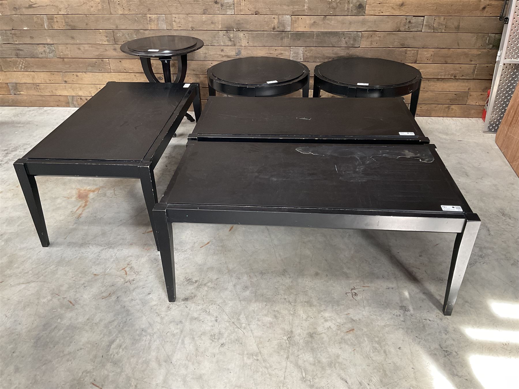 Three rectangular ebonised coffee tables and three circular tables