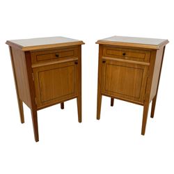 Pair of contemporary cherry wood bedside cupboards, inset glass top in moulded frame, fitted with single drawer over cupboard, on square tapering supports 