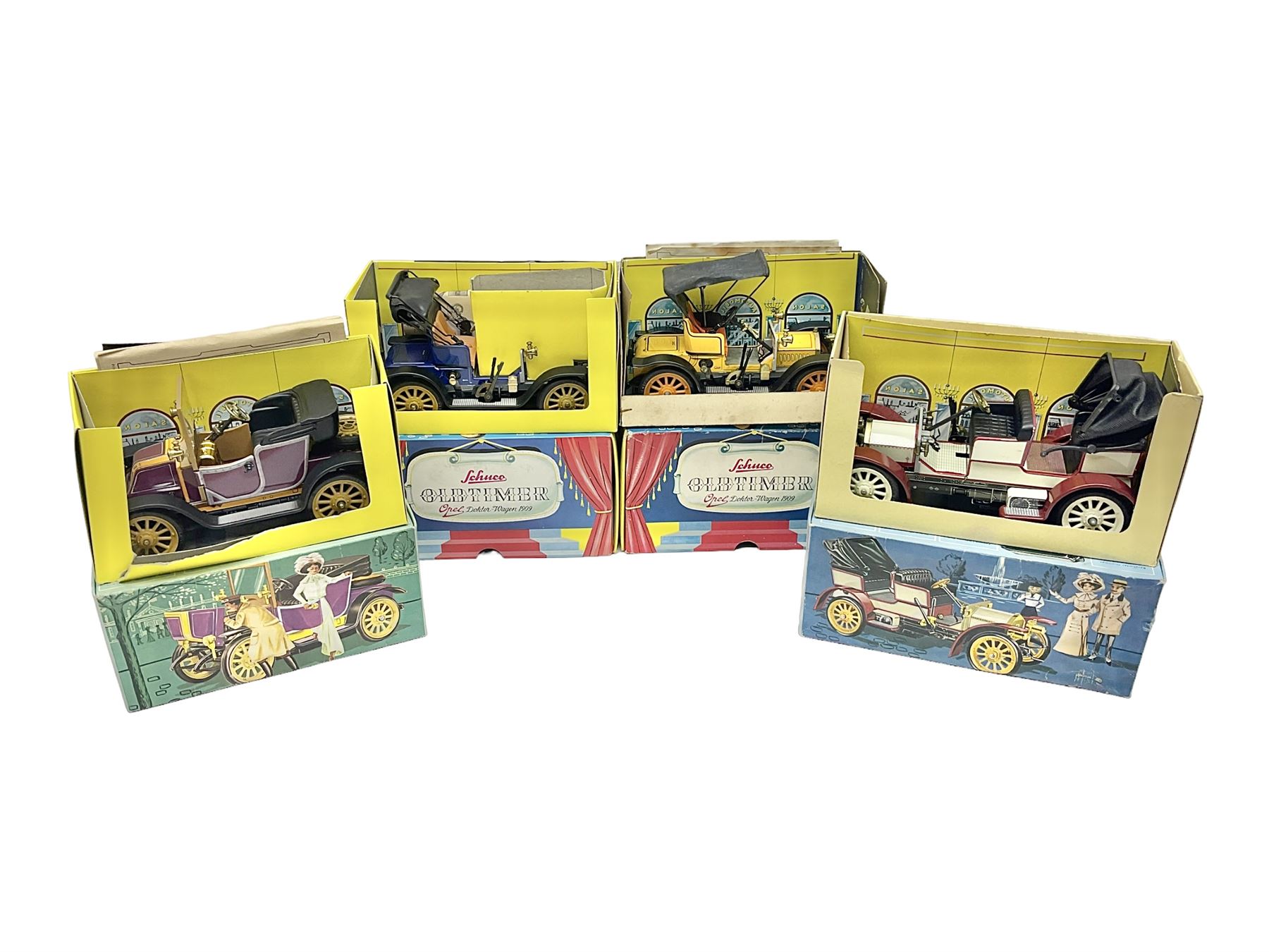 Schuco - four boxed Old Timer series tin-plate model cars comprising two  1228 Opel Doktor-Wagen