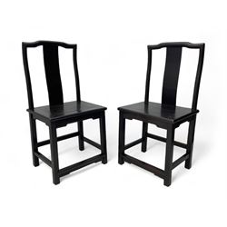 Pair of early 19th century Chinese Qing dynasty black wood side chairs, yoke cresting rail...