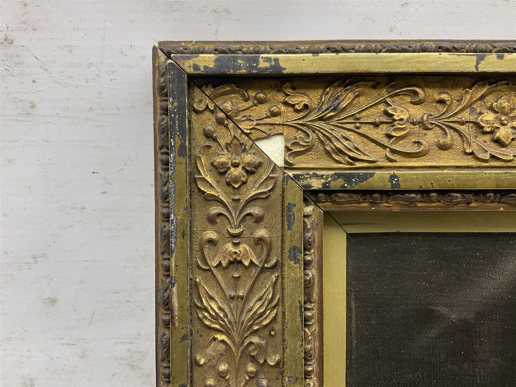 Early 20th century silk needlework panel, depicting a ship in full sail and Royal Coat of Arms to centre, with red and white ensigns to either side, lion and unicorn below with quote 'Dieu Et Mon Droit', upon a black silk ground within gilt frame, H59cm