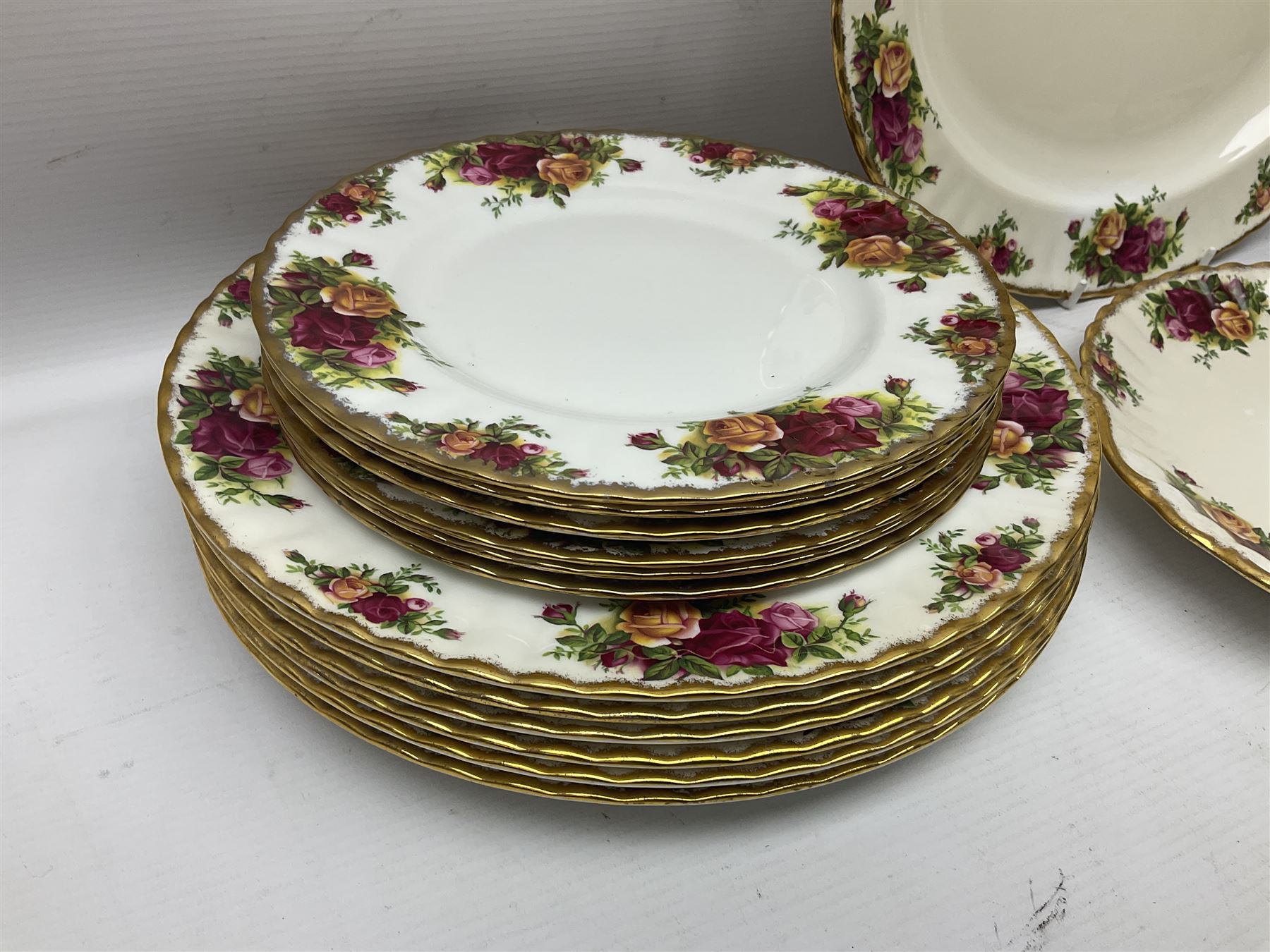 Royal Albert Old Country Roses pattern coffee set for four, comprising coffee pot, milk jug, cups and saucers, cake plate, together with six dinner plates, side plates etc (34) 