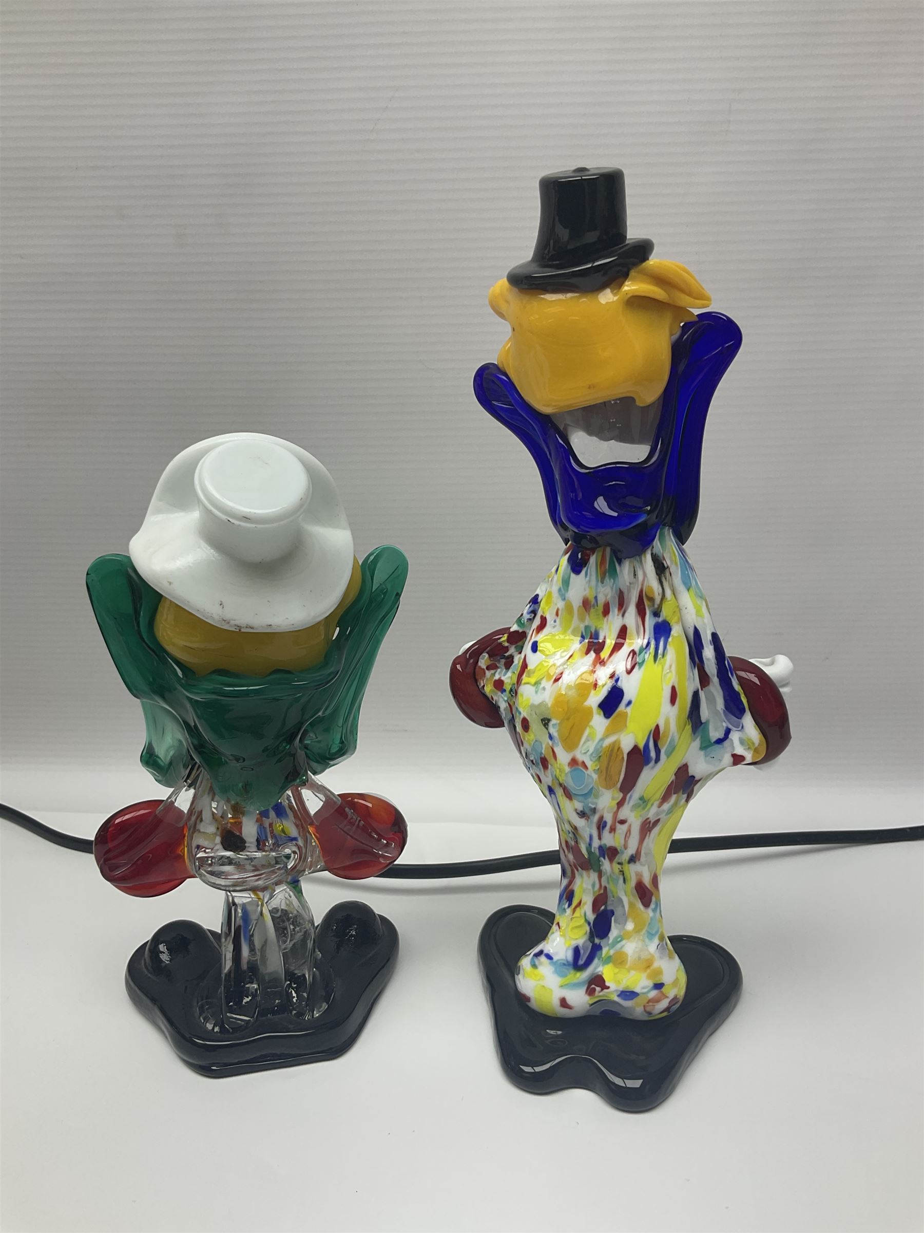 Two Murano glass clowns, together with Hornsea Fauna vases and similar and a table lamp  