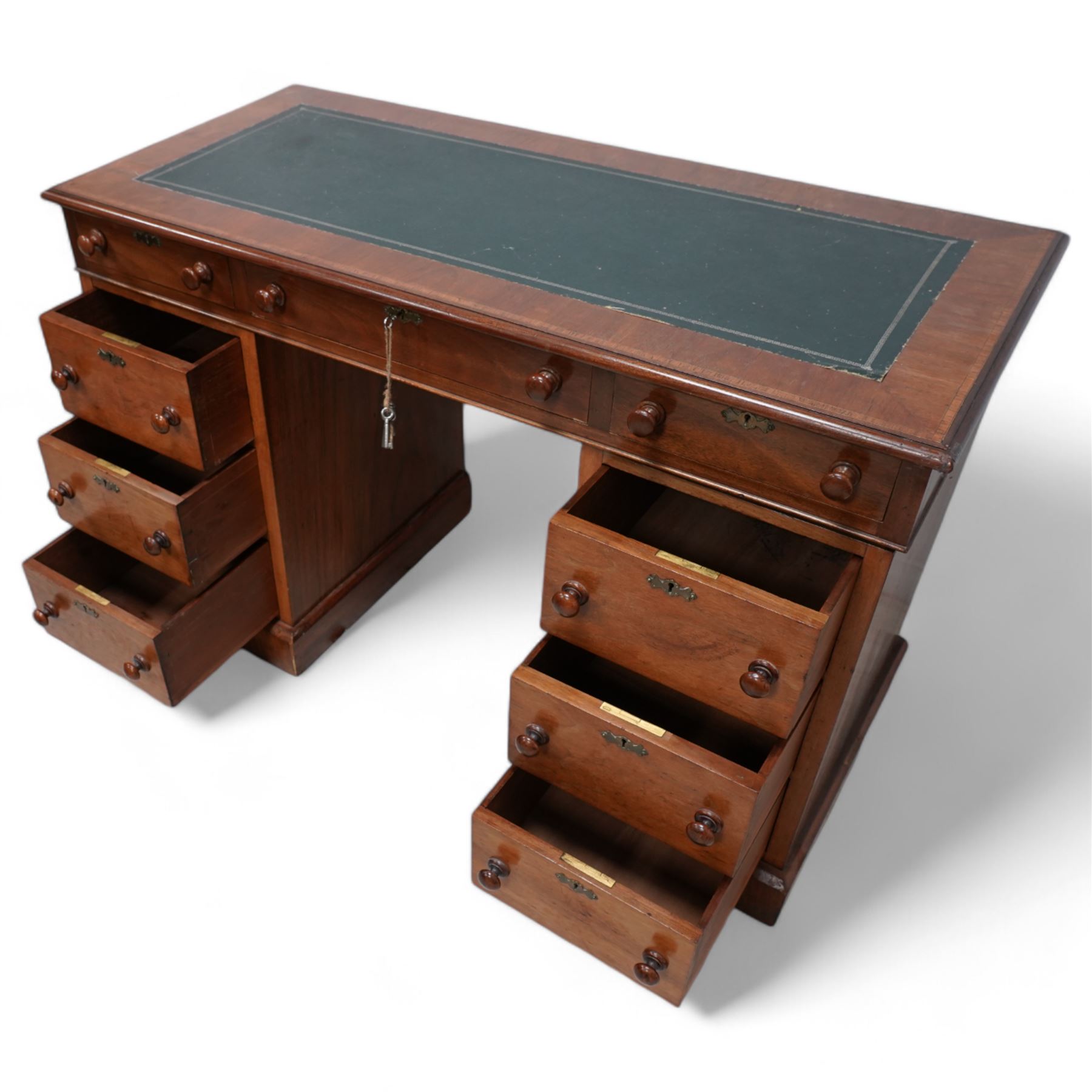 19th century mahogany twin pedestal desk, rectangular top with inset green leather writing surface, fitted with single frieze drawer flanked by four drawers to each side, each with shaped metal escutcheons, on skirted base