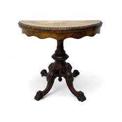 Victorian walnut demi-lune card table, circular fold-over top with foliate carved edge, re...